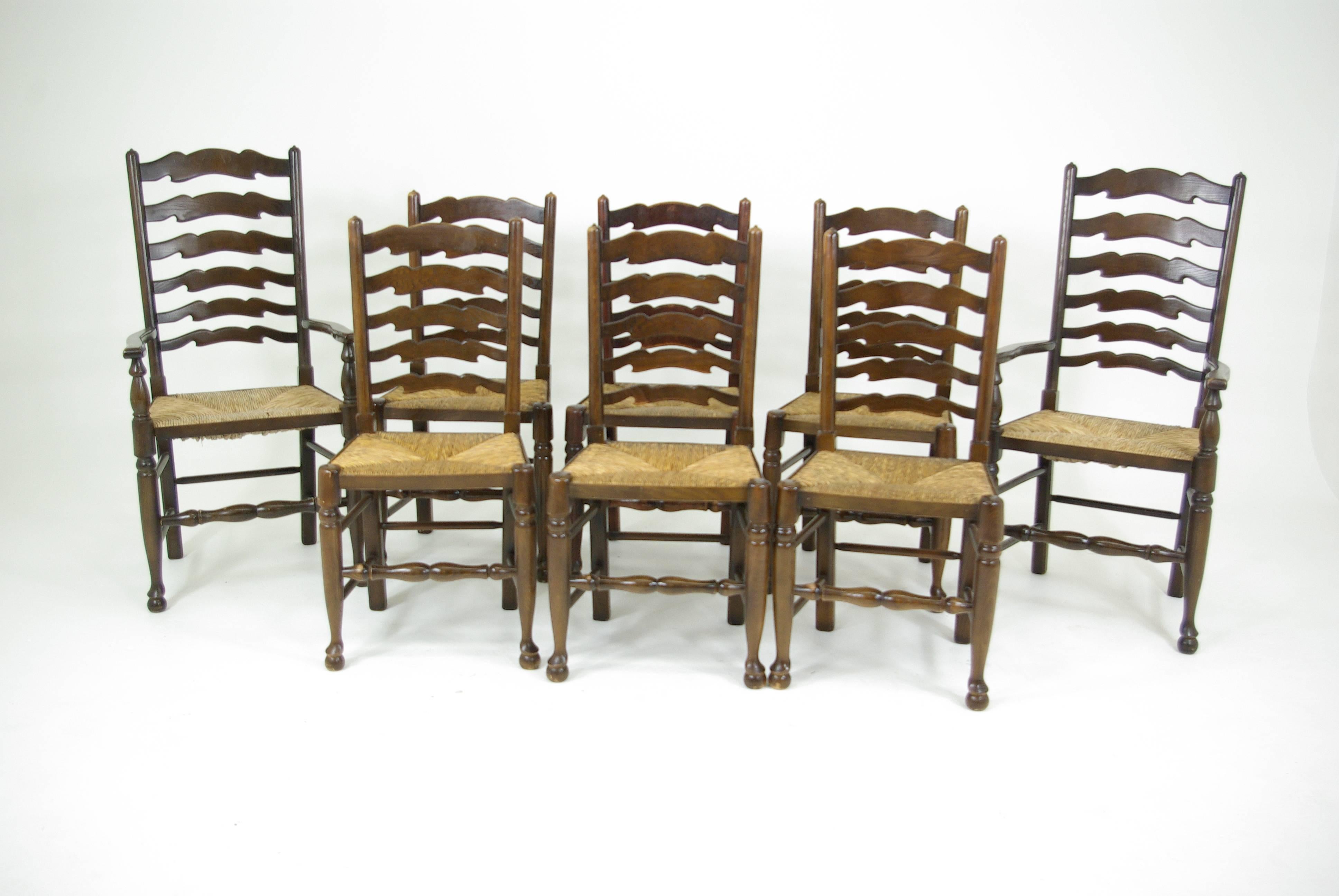 Scotland, 1930.
Solid oak and elm construction.
Original finish in
rush seats in excellent condition.
All joints are tight.

$1450 for the set of eight. 

Item #B319.
Armchair 22