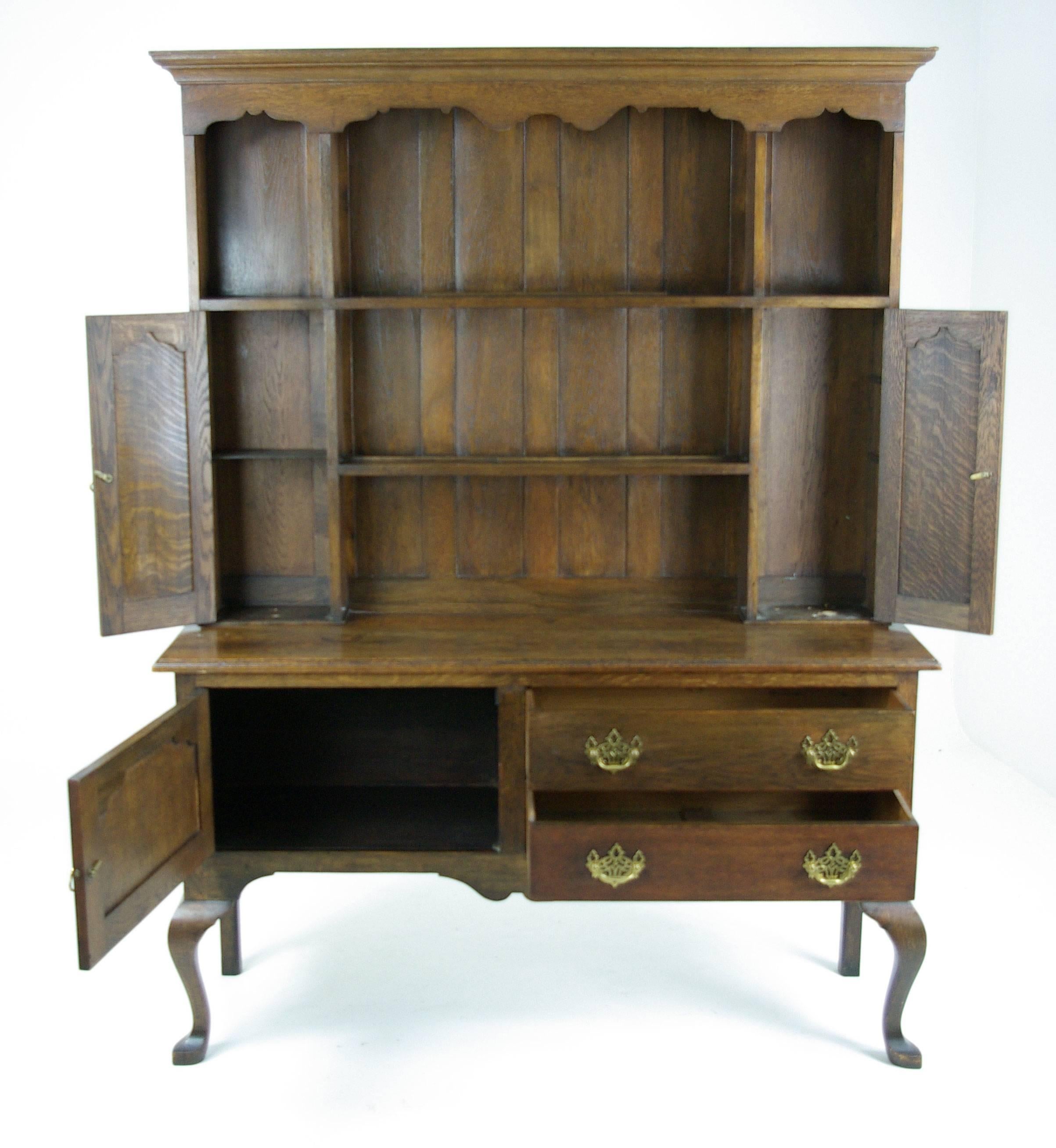 Scotland,
1890.
Solid oak, original finish.
Traditional top with open plate rack.
Base with single door and two drawers.
Original hardware.
Ending on cabriole legs.

$1850.

Base 59
