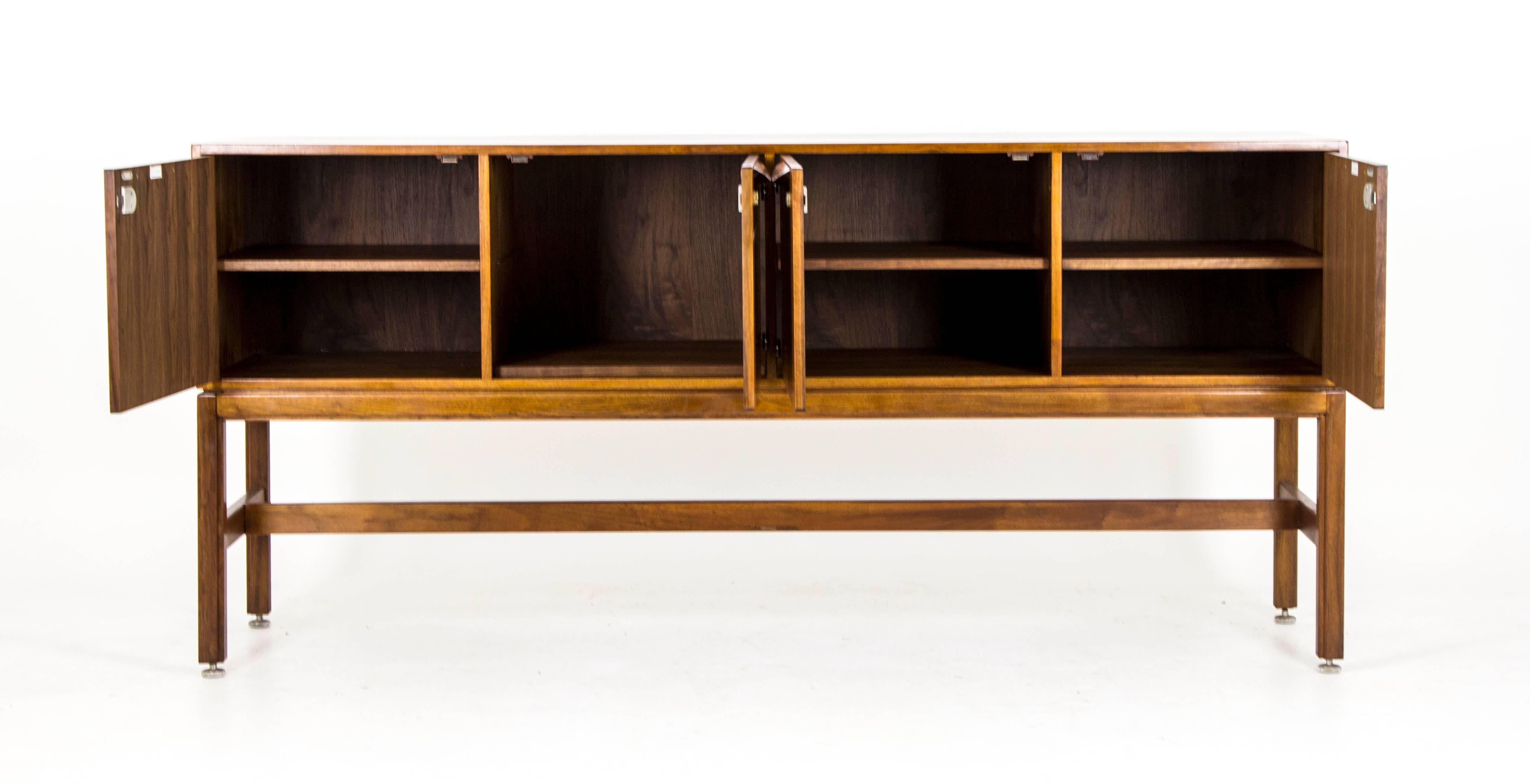Denmark
1950
Rosewood sideboard designed by Jens Rison
Scalloped rosewood handles
Total of four cabinets with shelving, all lockable
Bullet shaped nickel-plated hinges
Finished back
Appears to be floating on base

$3950

B519A
Measures: