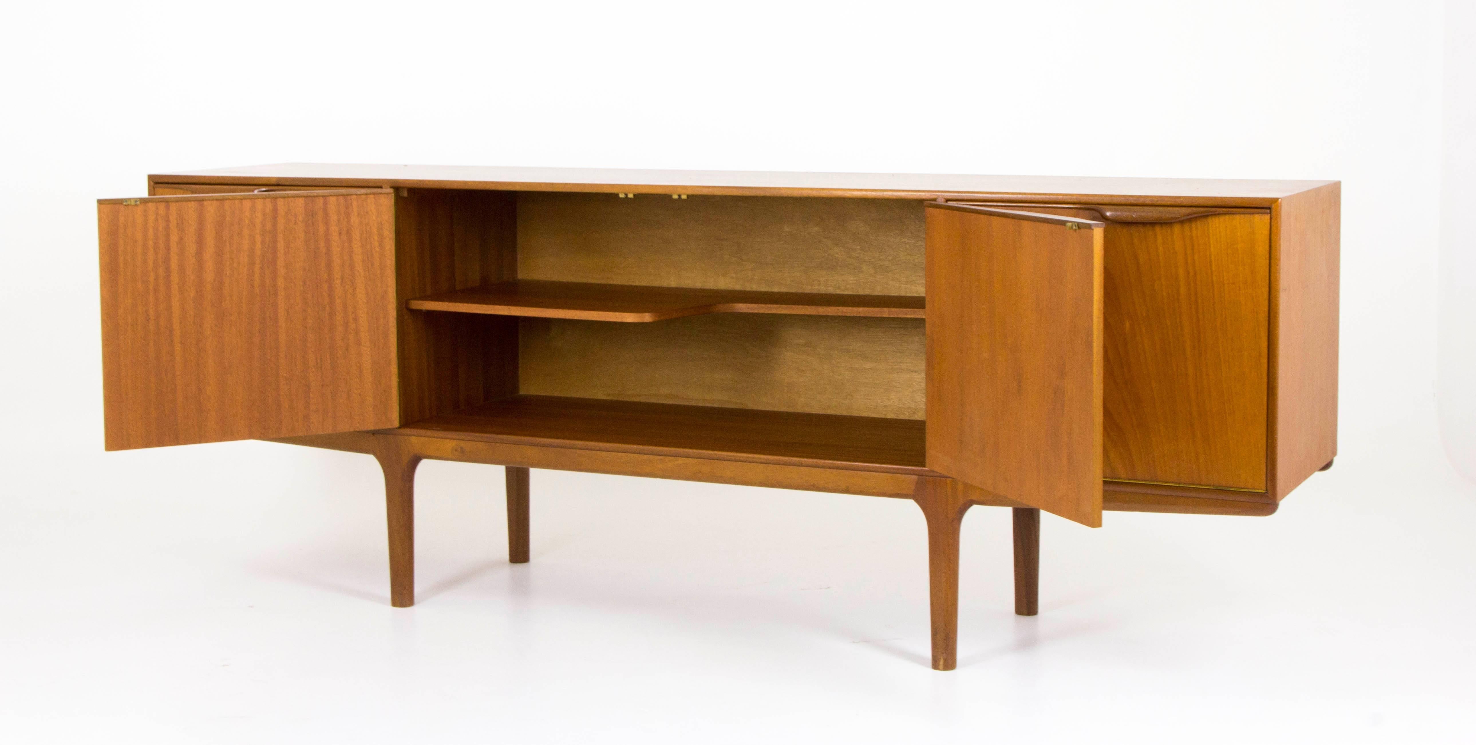 Scotland, 1960s
All original and excellent condition
Low sleek lines
Three drawers on left side
Behind two centre door a fixed symmetrical shelf
Right door folds down to reveal storage and slide out tray.

$2950

B573
Measures: 80.5"