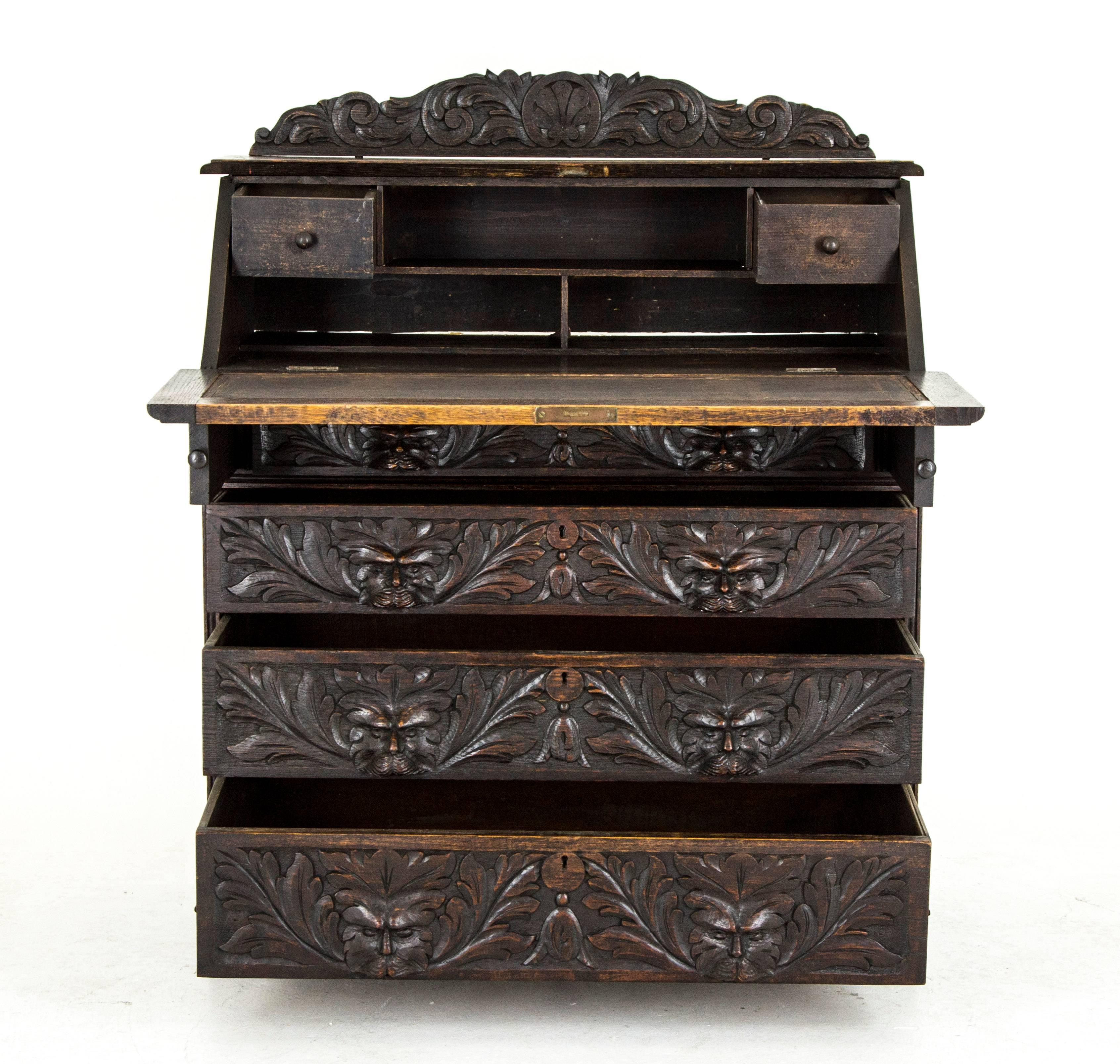 Scotland
1875
Solid oak construction
Original finish
Carved pediment above
Carved fall front lid with pull-out supports
Fitted interior with two drawers below with four dovetailed carved drawers
Carved sides
Ending on a shaped plinth