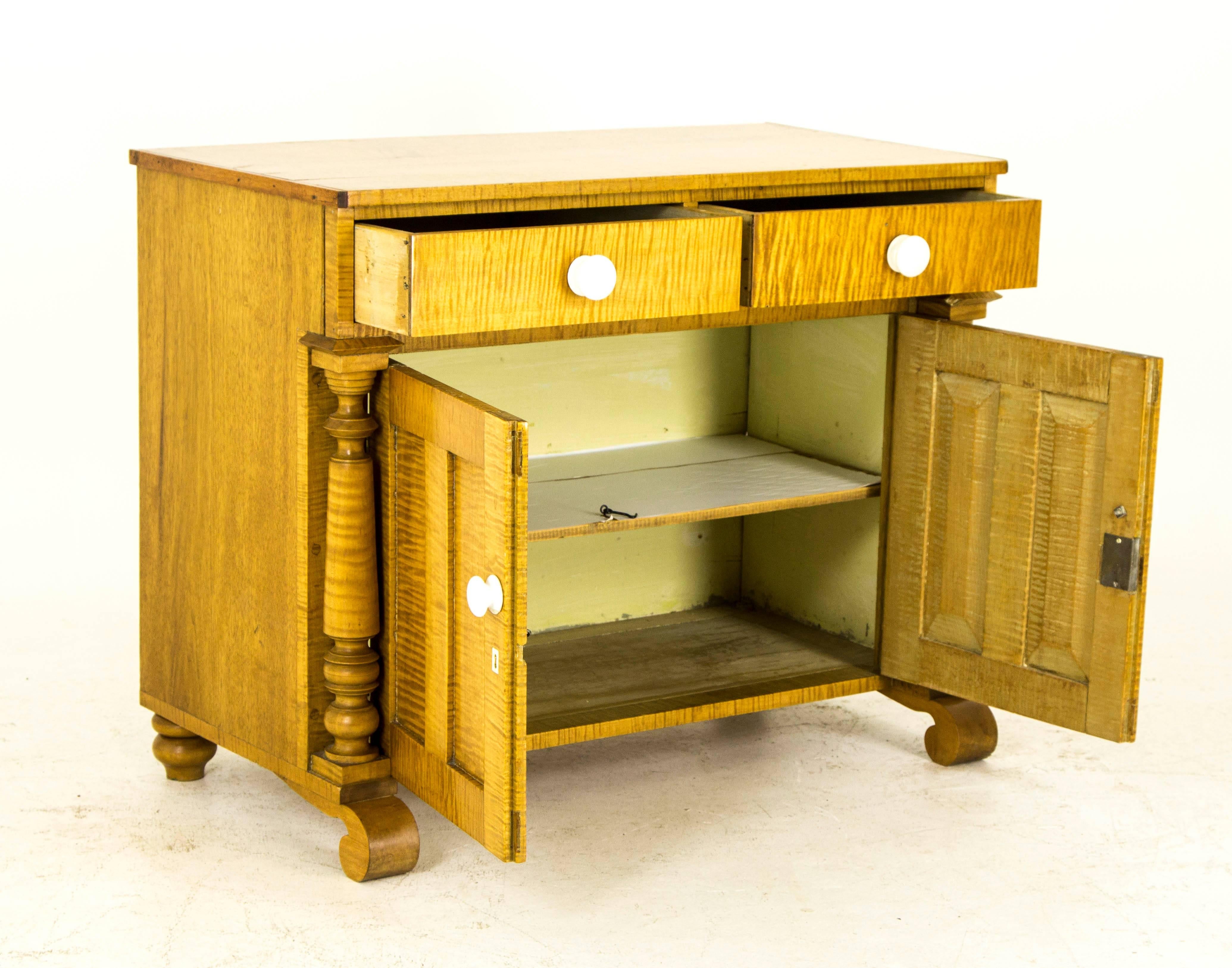 This antique French Canadian washstand is constructed of lovely tiger stripe maple and can be used as s dry sink or commode. The height is ideal for a baby changing table and would make an excellent gift for an expectant or new mother also.