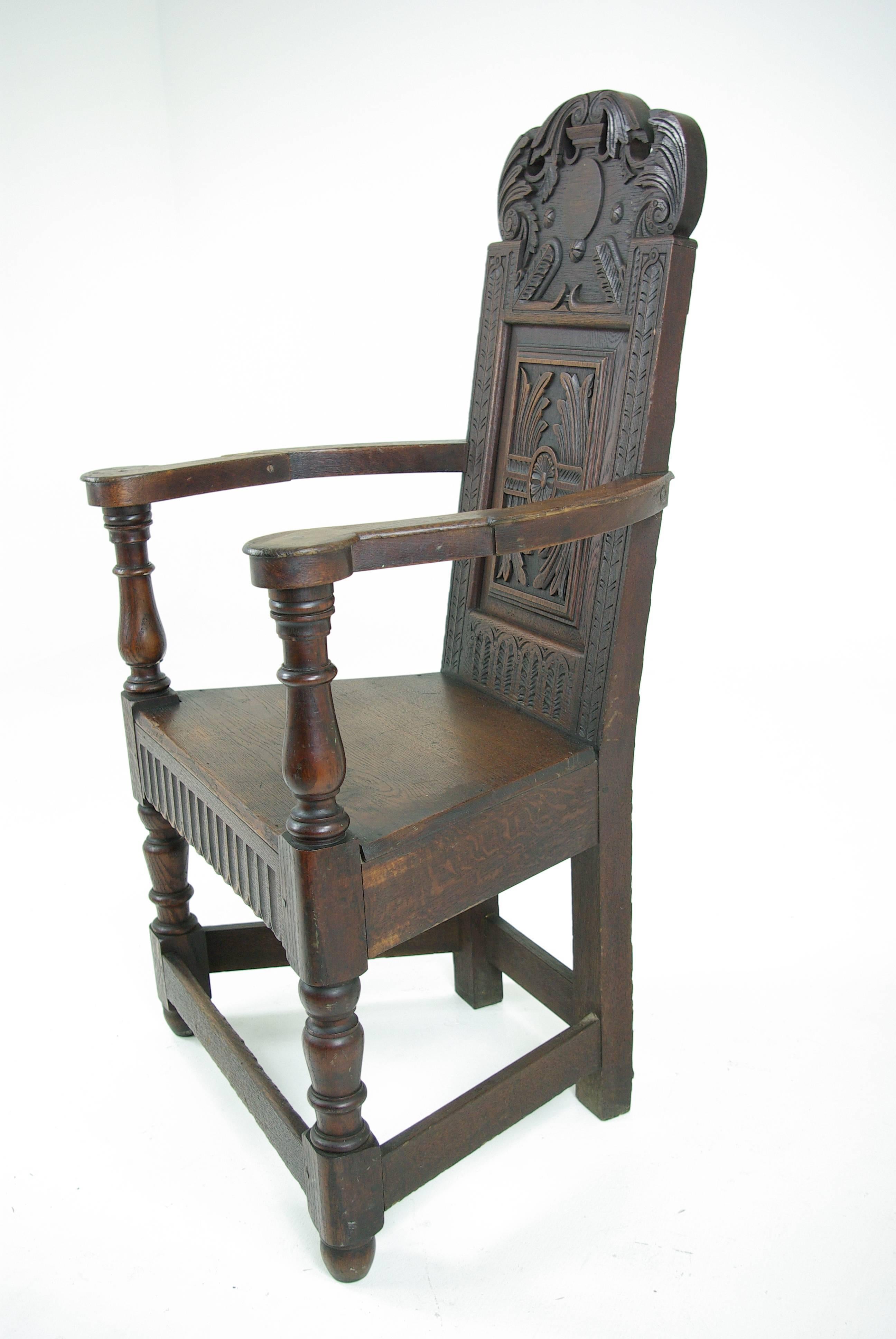 Carved Hall Chair, Oak, Solid Seat, Scotland 1840, B541 REDUCED!!

Scotland 
1840
Solid oak construction, original finish
Carved back
Curved shaped arms
Solid wooden seat
Heavy cross stretchers on base

Was $950  now just 

B541
Measures: 25