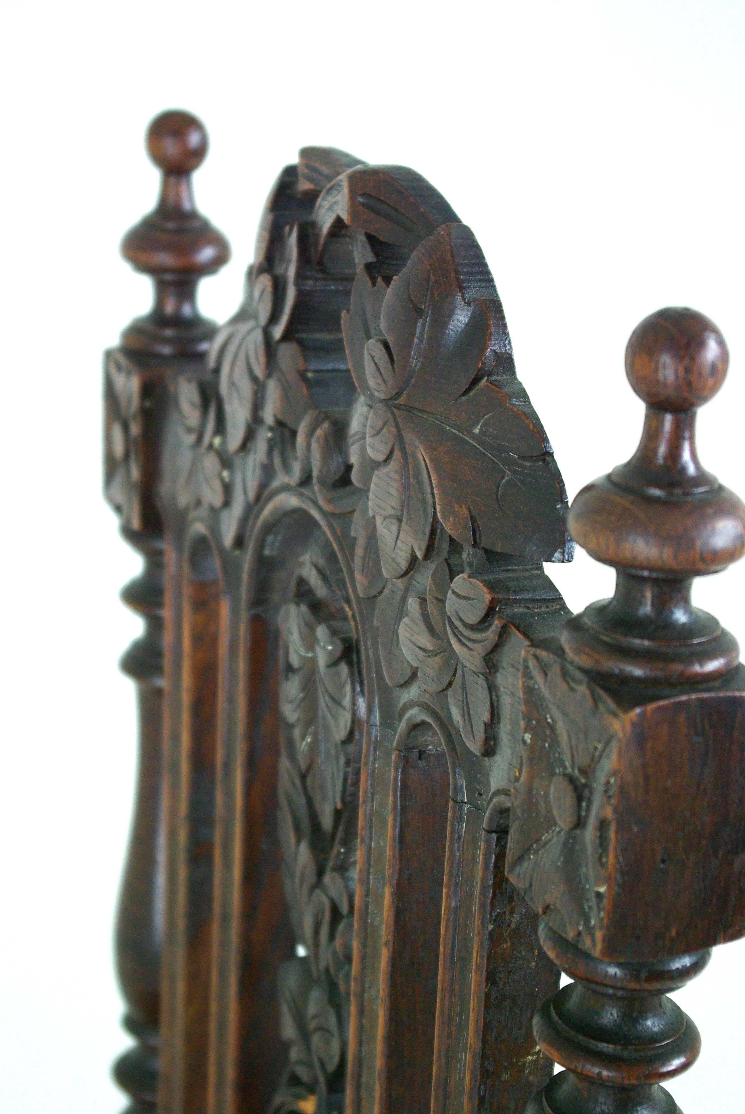 Two antique hall chairs Victorian hall chairs, Scotland, 1880, B763

Scotland, 1880s
Solid oak construction
Original dark oak finish
Very pretty carved splats with fruit vines
Elegant turned finials
Turned supports, upholstered seats
Ending on