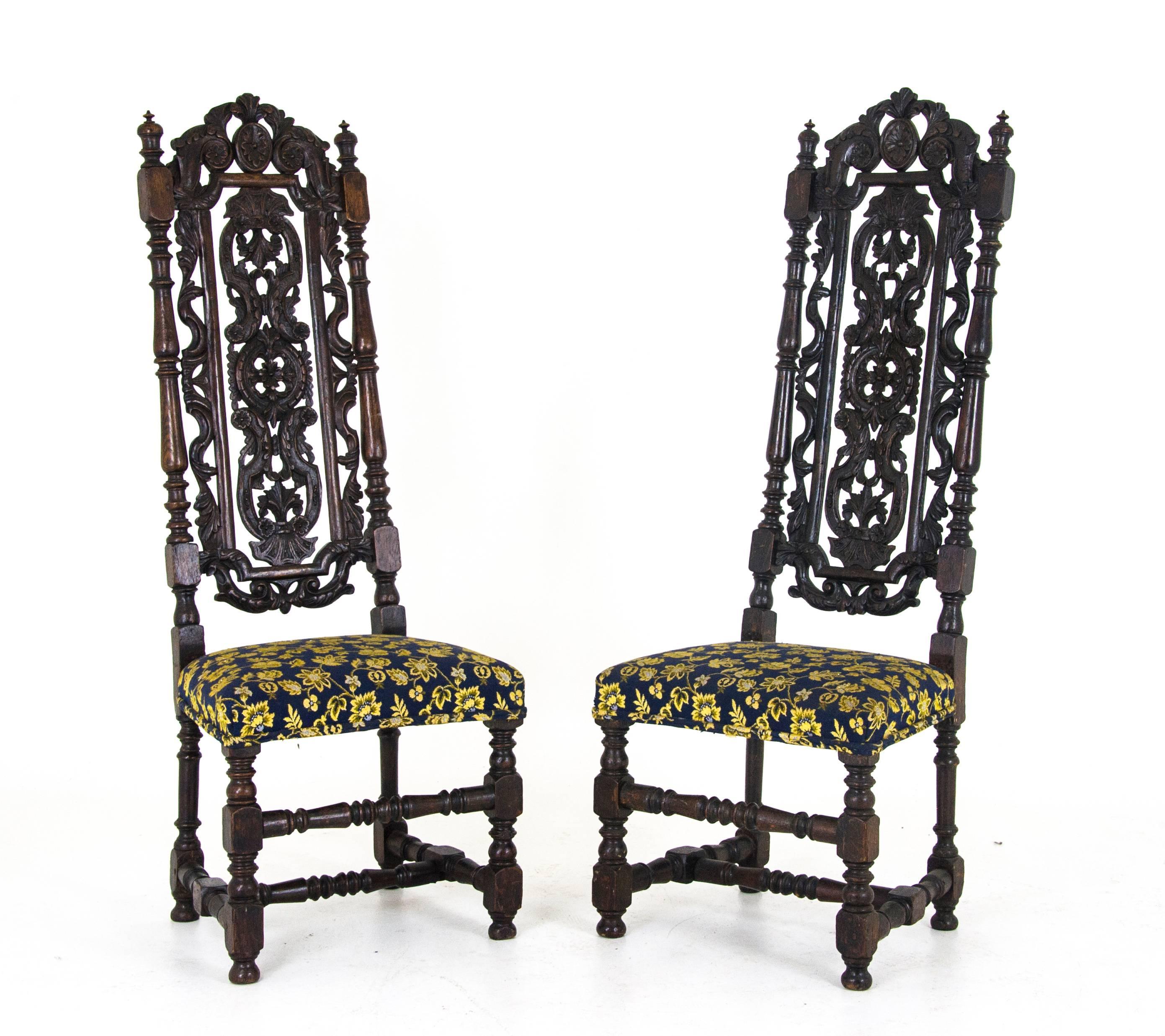 Antique carved chairs Carolean style upholstered, high back, Scotland, 1870 

Scotland, 1870
Solid oak construction
Original finish
Profusely carved to the back
Panel top rail
Side rails turned and capped with finials
Upholstered seat
Ending on