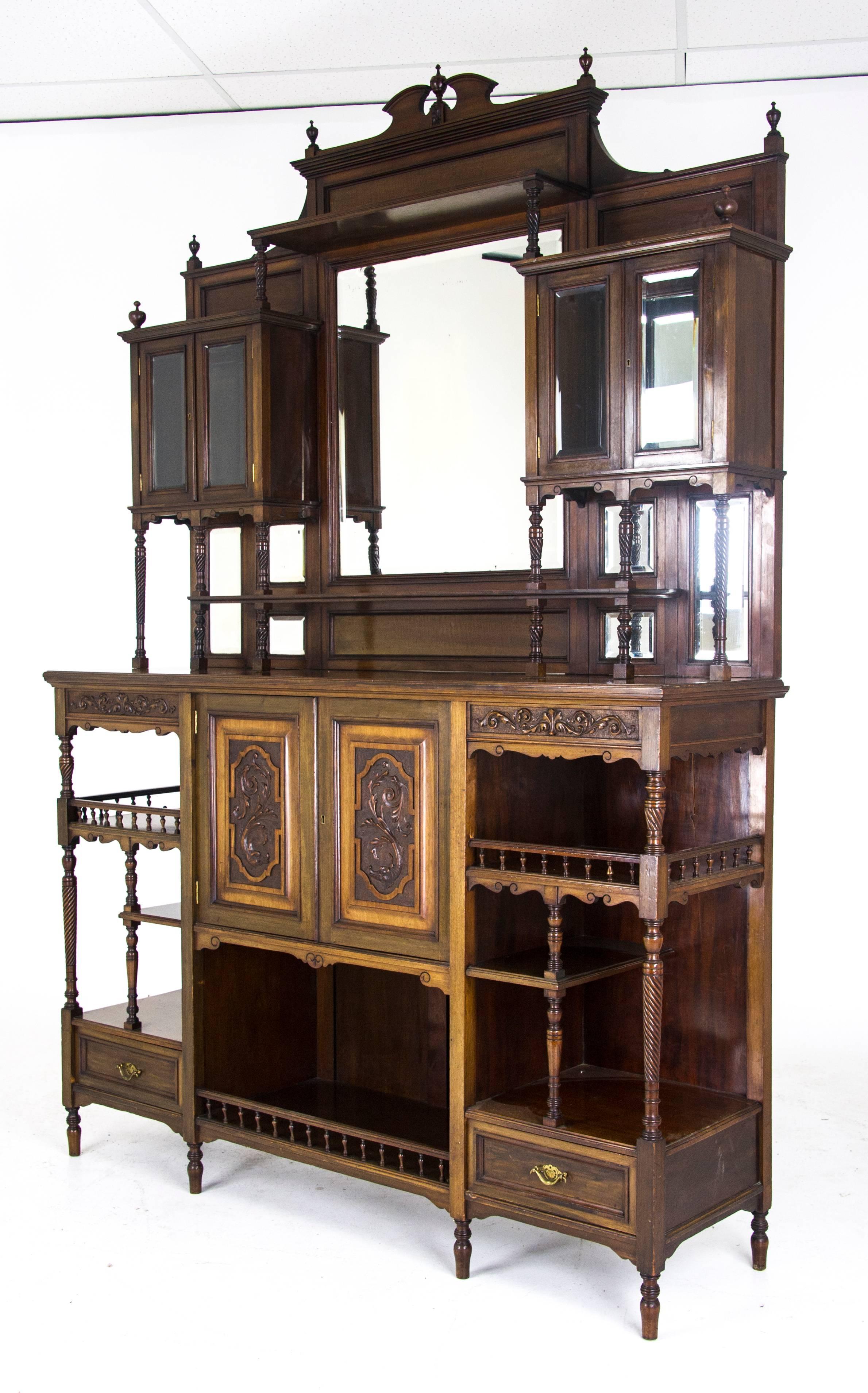 Antique display cabinet Victorian mirror back cabinet, Scotland 1870, B693

Scotland, 1870
Solid Walnut with original finish
Swan neck pediment gallery top
Large beveled mirror to the center
Two side cabinets with beveled glass and mirrors
Single