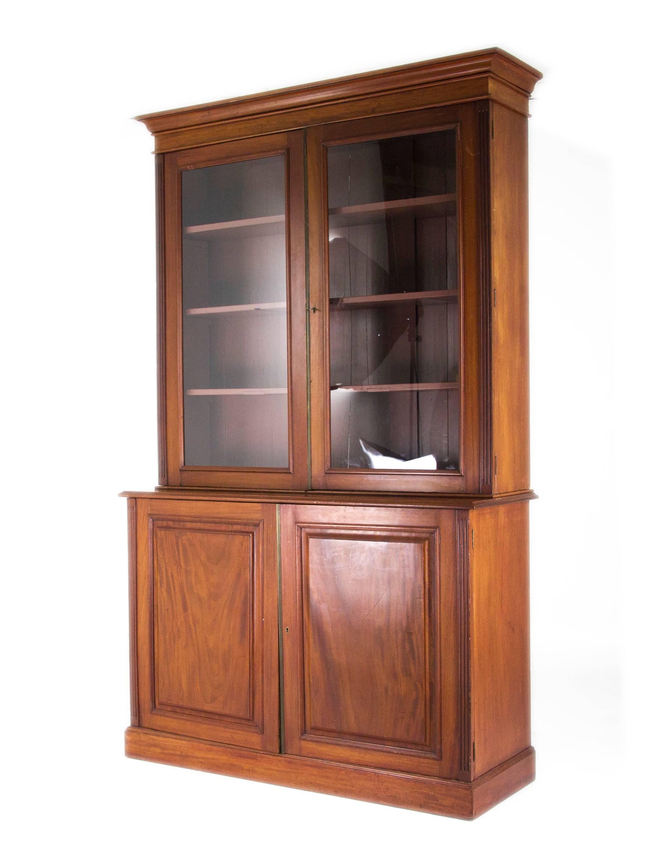 Scotland, 1870
Solid Walnut Construction
Original Finish
Flared Cornice Above
Two Glass Doors Below
Fitted with three Fixed Shelves and their dovetailed drawers
Two Paneled Doors Below with Single Fixed Shelf and Two Dovetailed Drawers
Ending on a