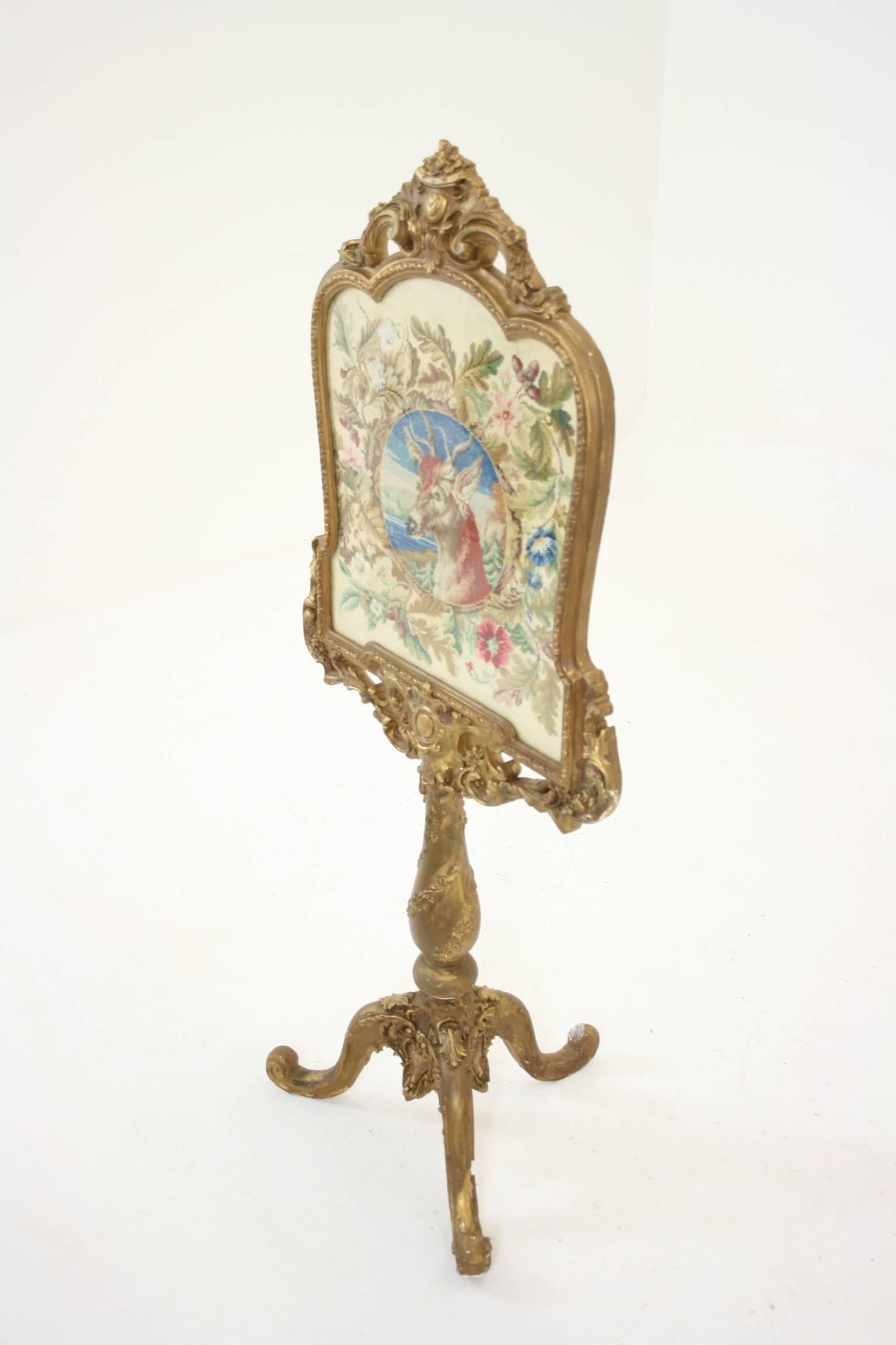 - $950
 - Scotland, 1840
 - Glass-front frame
 - Elk in a floral scene
 - Pierced centre shield
 - Original needlepoint
 - Sits on elaborate tripod base
 - Somme loss of plaster of Paris
 - 27″w x 17″d x 58″h
 - Item # C2362
 - Shipping