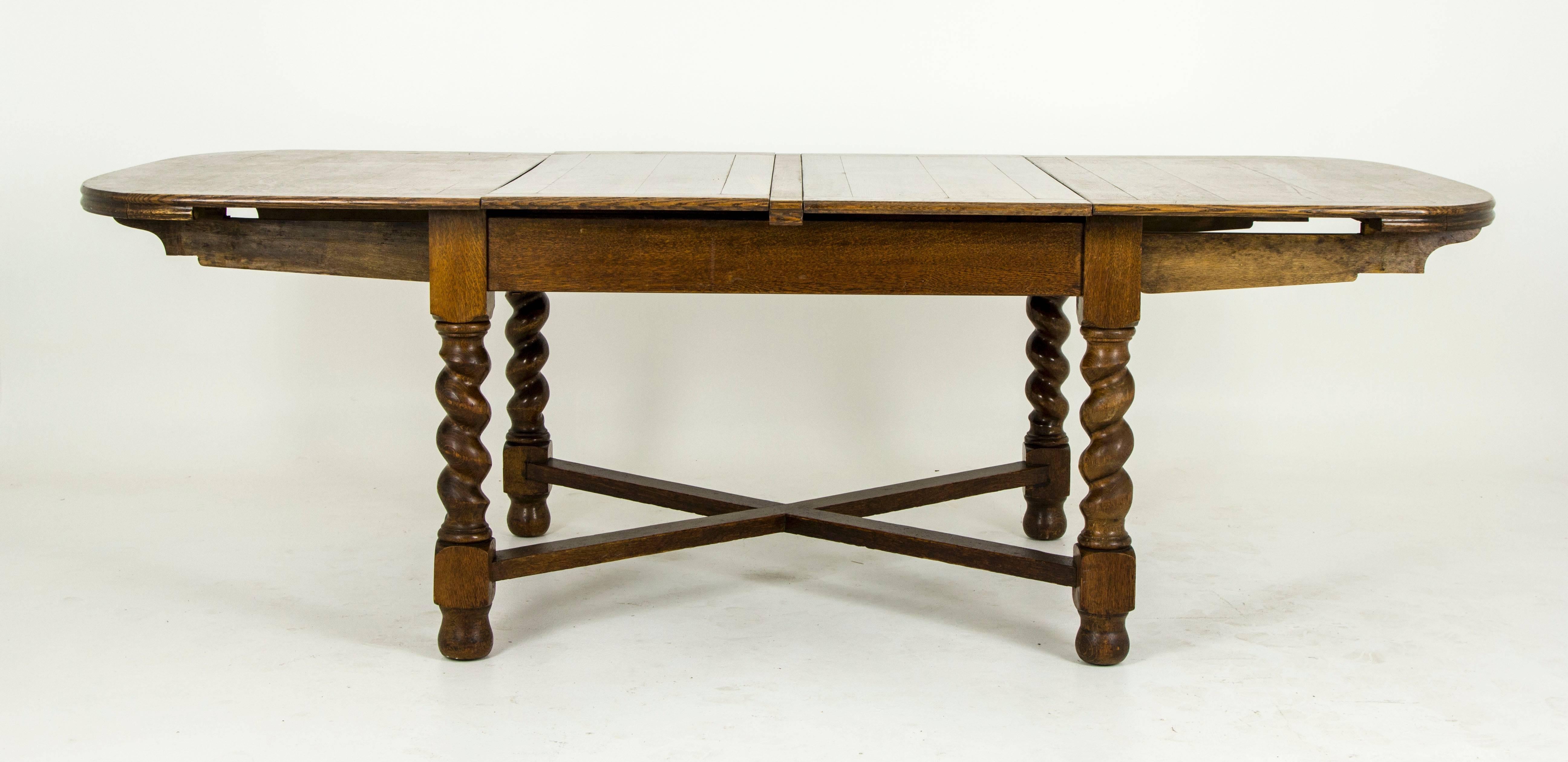 Solid oak construction and veneer.
Oversized table with extension hidden beneath.
All original finish with warm patina.
Four large barley twist legs.
Connected with thick cross stretchers.
Mechanism works smoothly.
Wonderful design.
Solid,