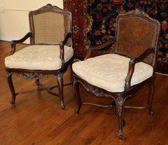 Pair of Louis XV Style Shell Carved Cane Arm Chairs