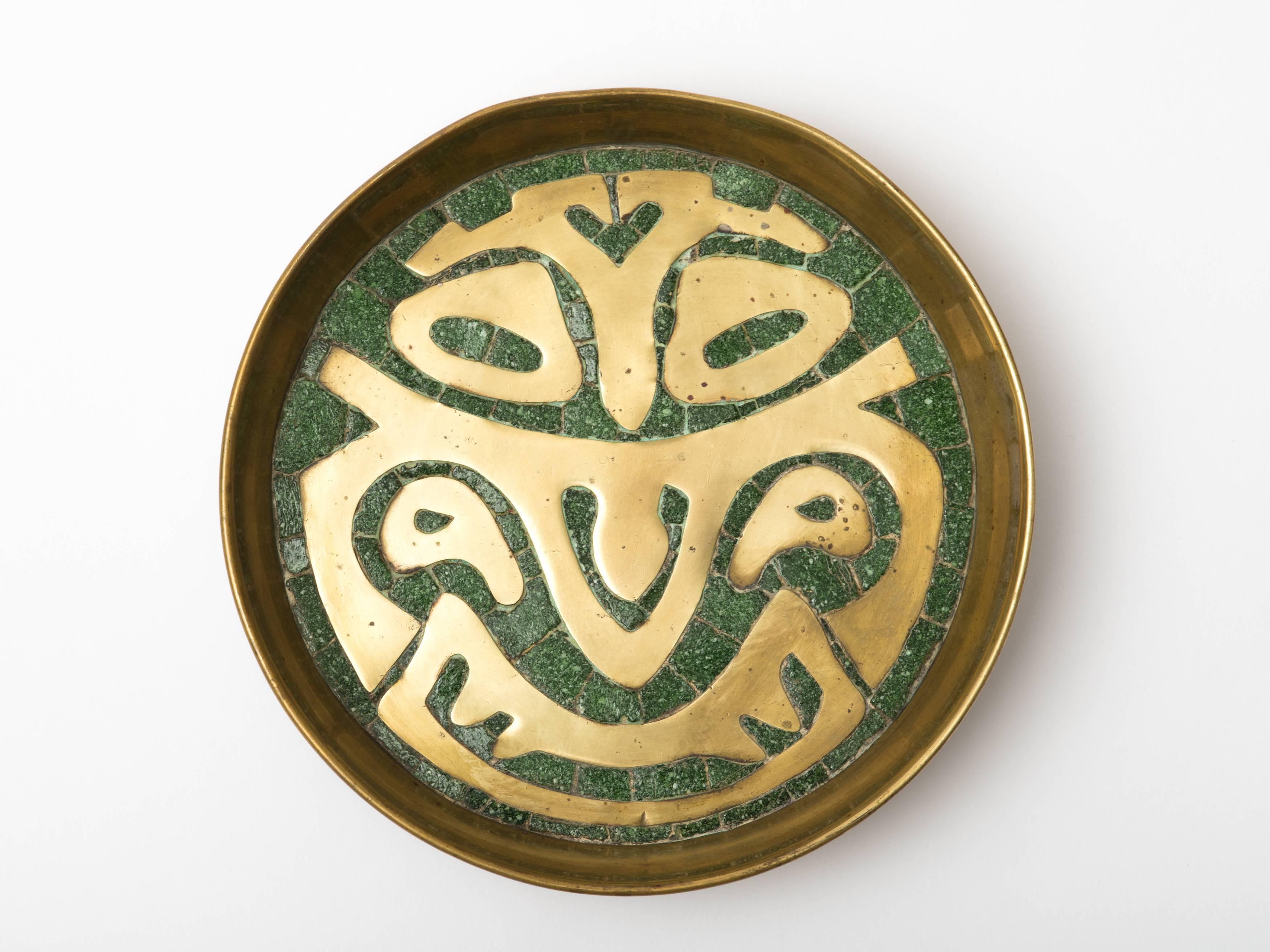 Circular brass and inlaid stone tray with Mexican modernist motif, unsigned. Attributed to Salvador Teran, Mexico, circa 1950s.