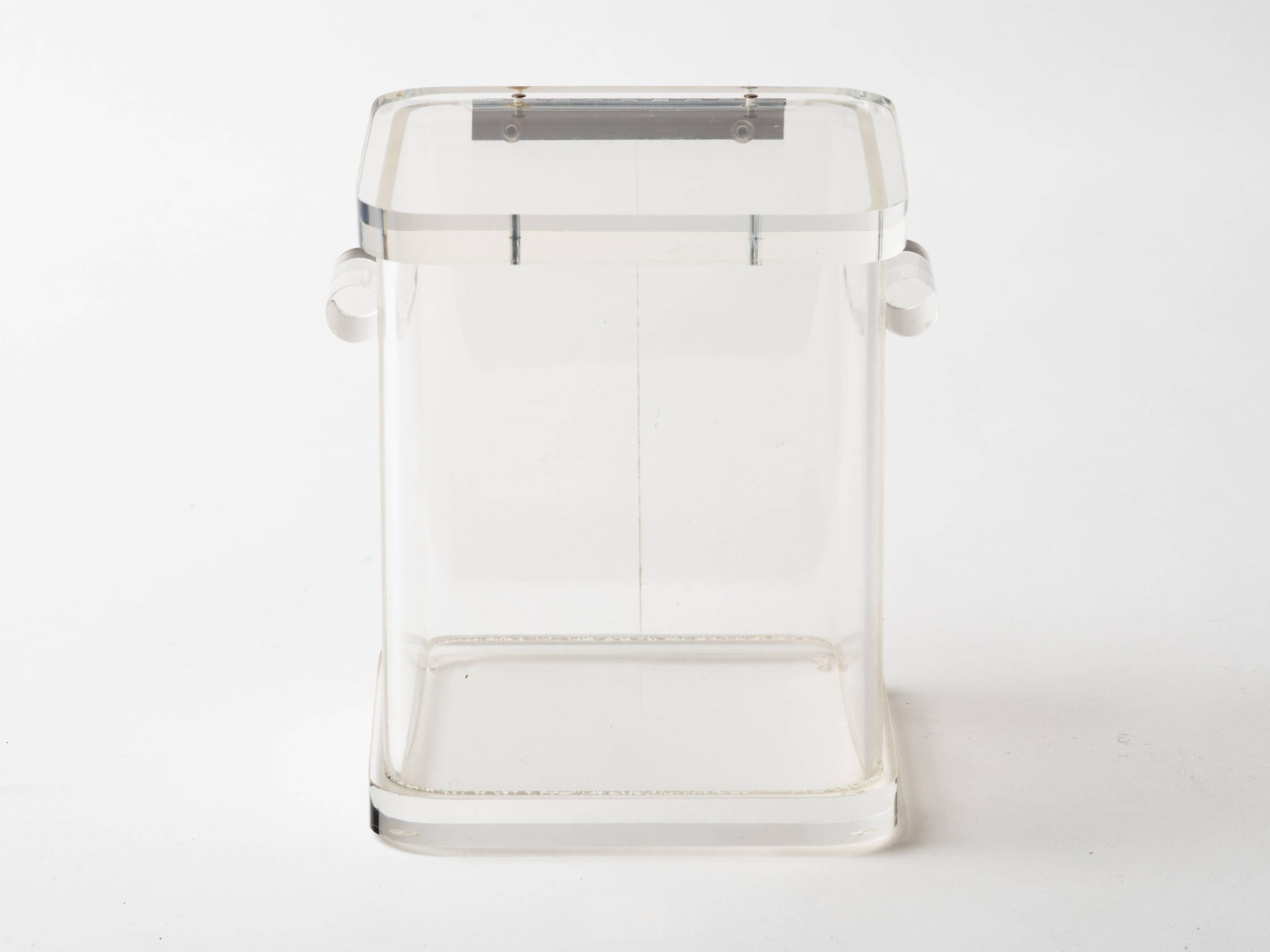 1970s Lucite ice bucket with two rounded handles and hinged lid.