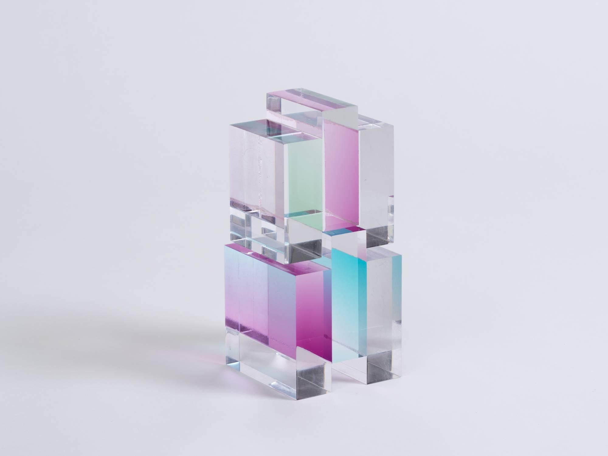 Stacking two-piece clear, magenta and turquoise acrylic cubist sculpture give an optical illusion when viewed from different perspectives. Unsigned, attributed to Vasa Mihich.