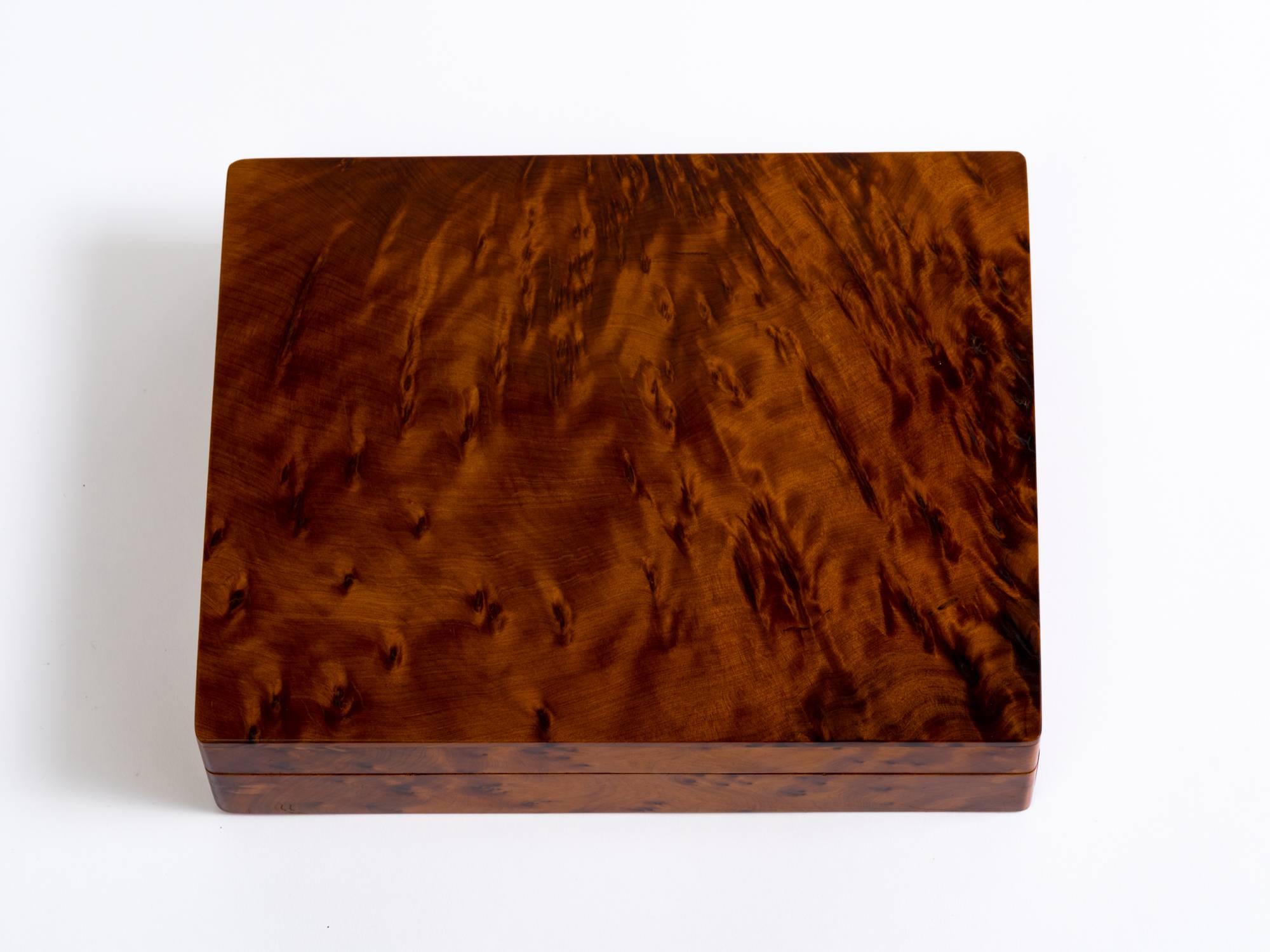 Rectangular Italian Art Deco cigar or jewelry box is crafted in a beautiful grain burl wood with a soft, buttery texture.