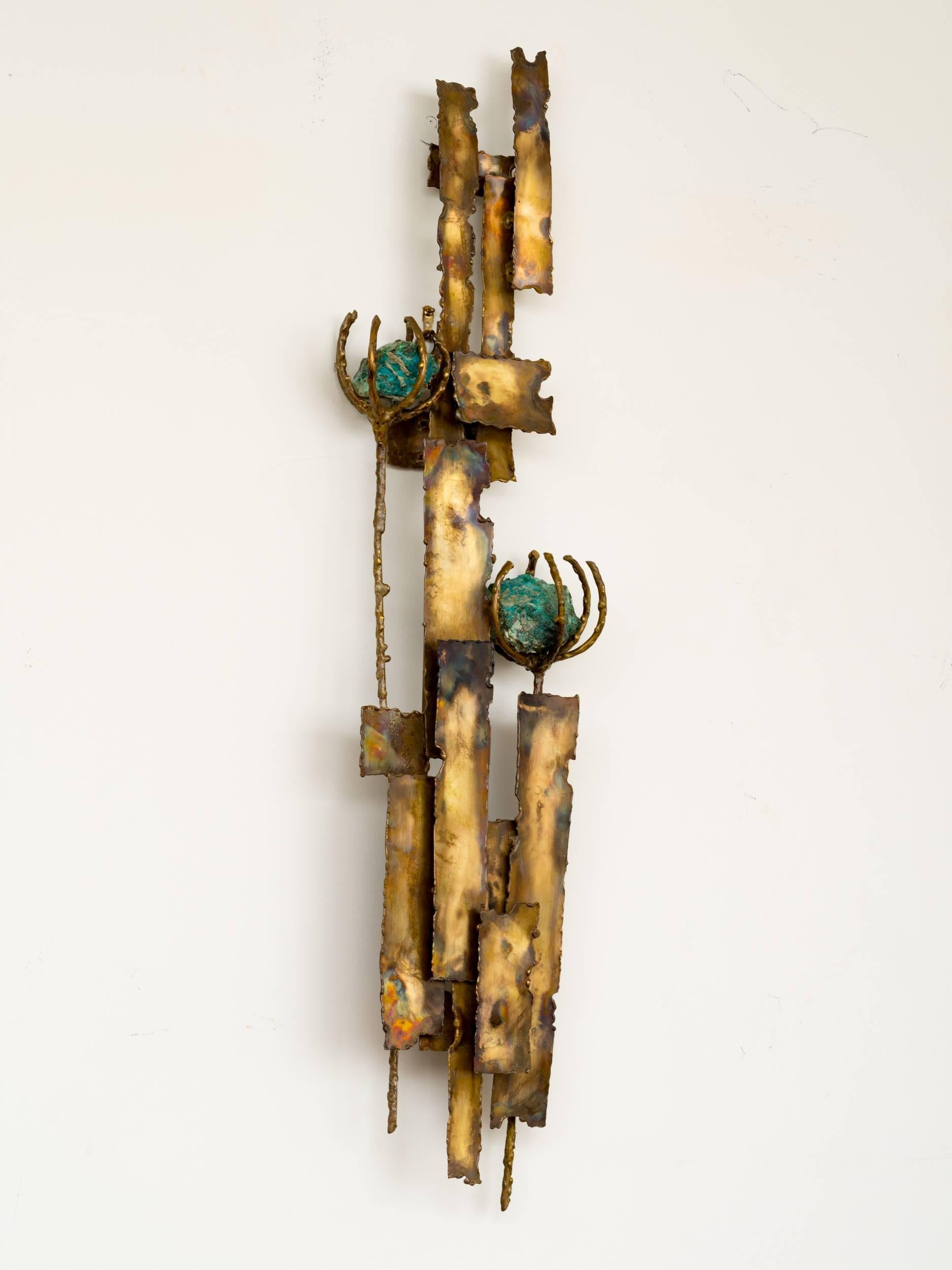 Brutalist torch cut brass sculpture with two turquoise stone flowers. Wall mounts with brass loops on back.