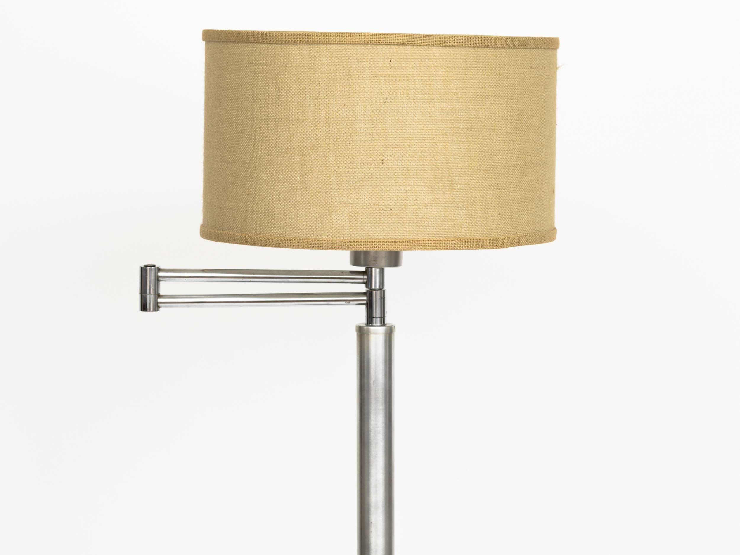 Machine Age brushed aluminium adjustable swing arm floor lamp with milk glass shade diffuser.  
Lamp shade not included.