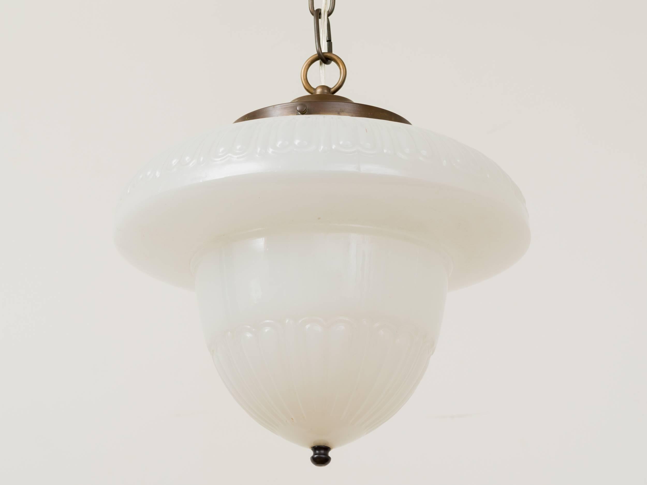 Rare form 1920s milk glass acorn pendant chandelier with brass chain and ceiling cap. Height can be adjusted by adding a longer chain.