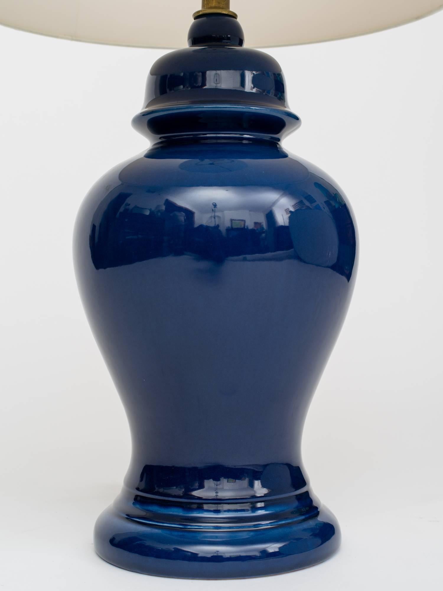 Gorgeous pair of 1960s indigo ceramic ginger jar form lamps. 
Lamp body measures 20