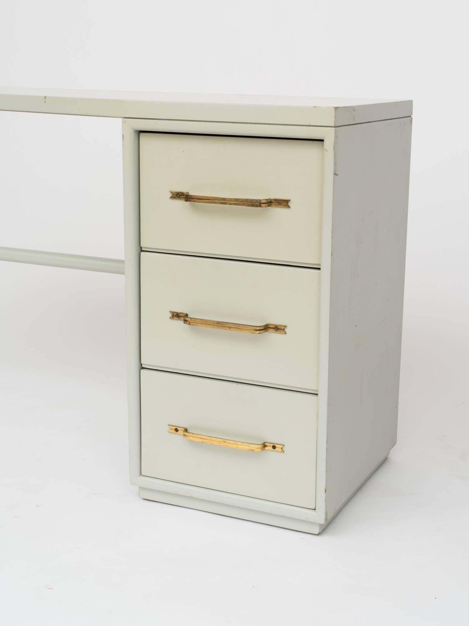 Mid-Century Modern Tommi Parzinger Style Celadon Lacquered Desk with Signature Brass Ribbon Handles For Sale