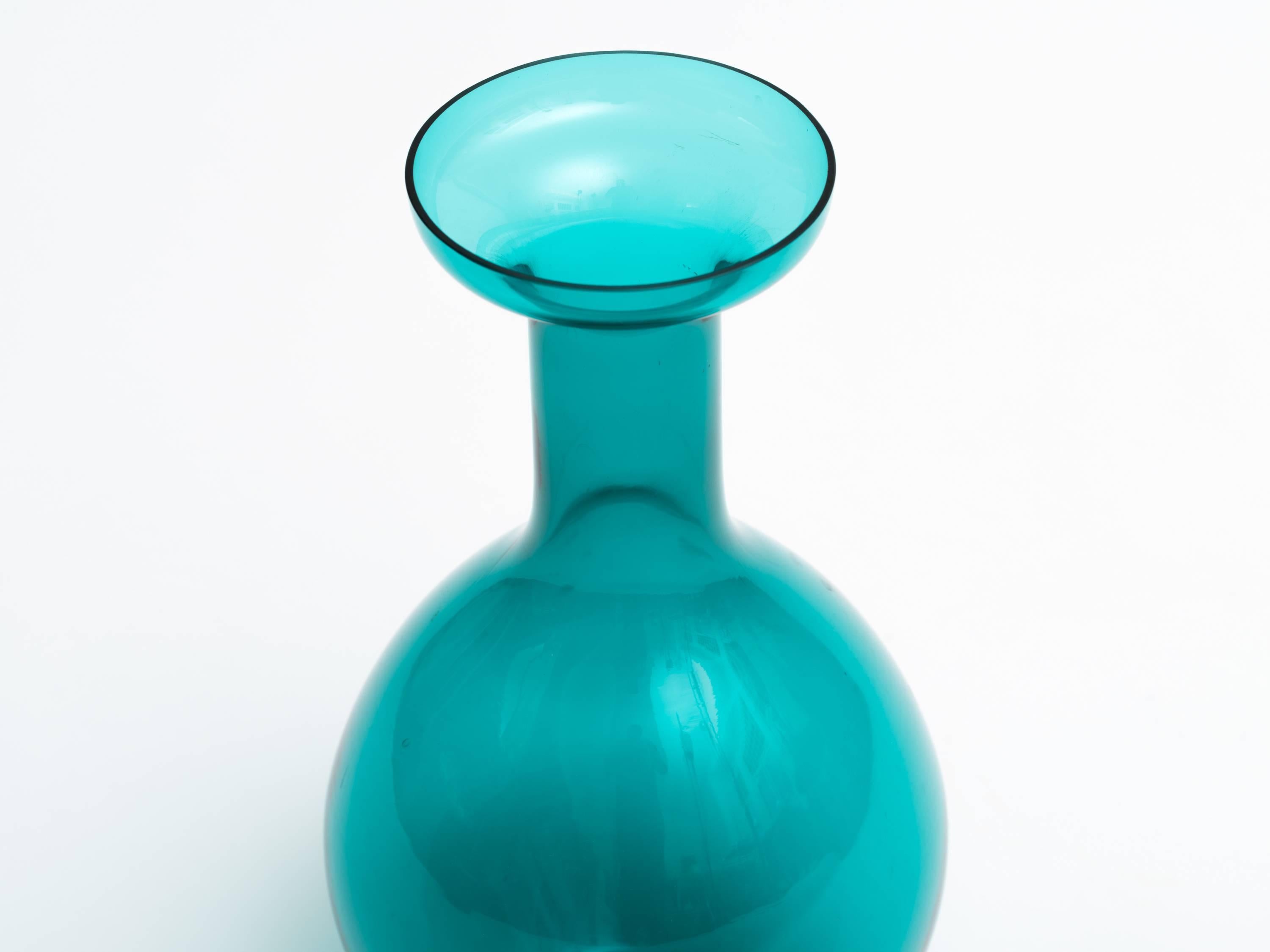 Tall green glass bottle vase with rim. 
Made in Italy by Empoli, circa 1970s.