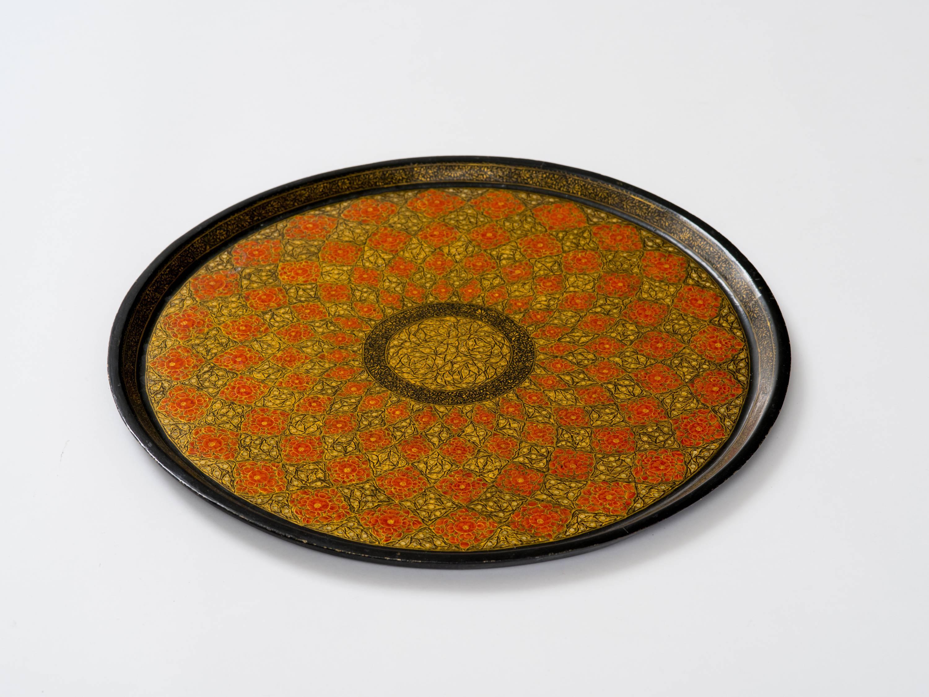 Finely detailed Kashmiri hand-painted and lacquered serving tray in traditional Mughal design, India, circa 1960s.