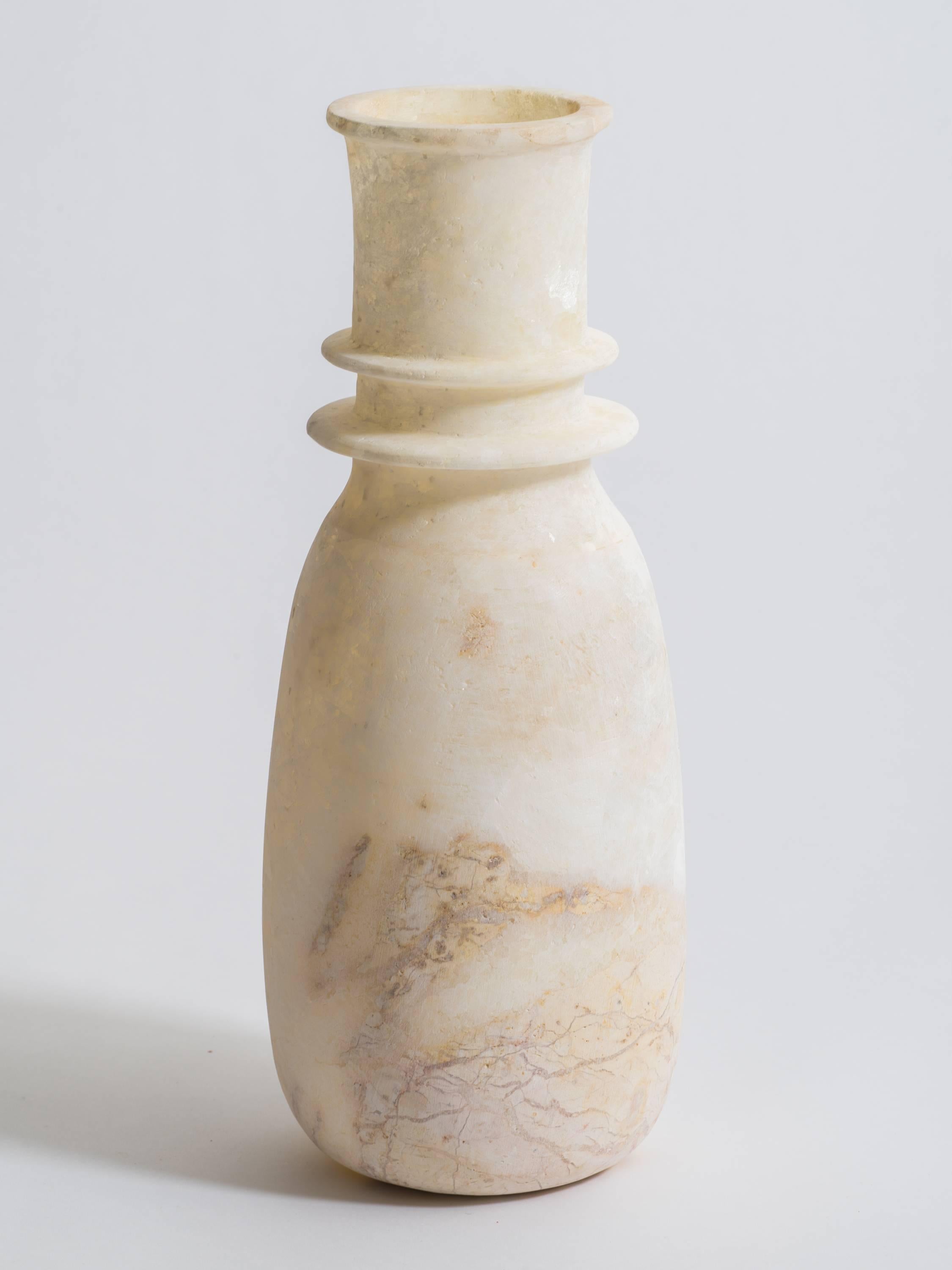 Tall Egyptian hand-carved alabaster ovoid form vase with double rim. Natural gypsum alabaster is milky white with natural veining.