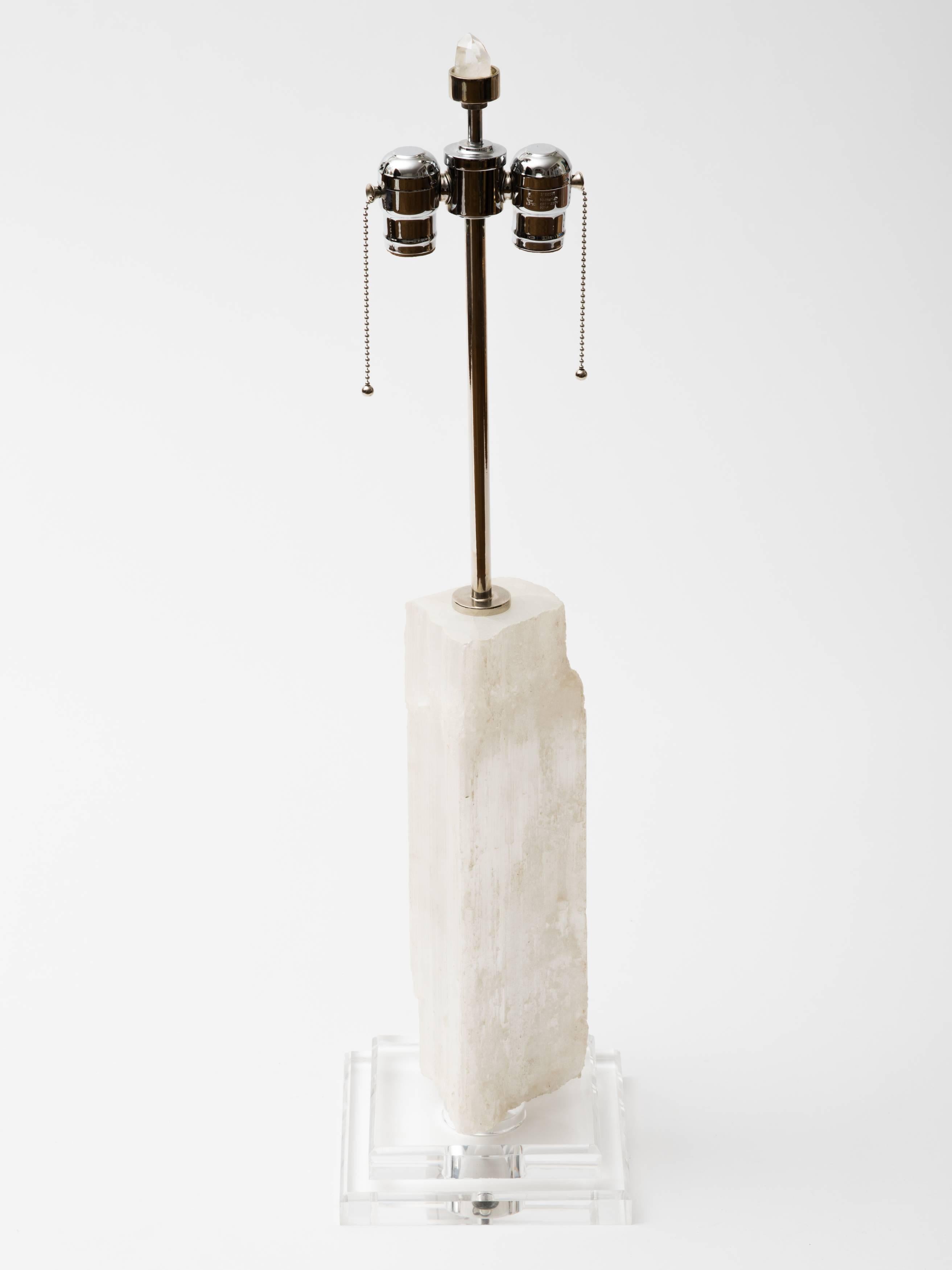 Selenite specimen column lamp with Lucite stepped pedestal square base.
Rock crystal and nickel finial attaches to double socketed nickeled hardware.