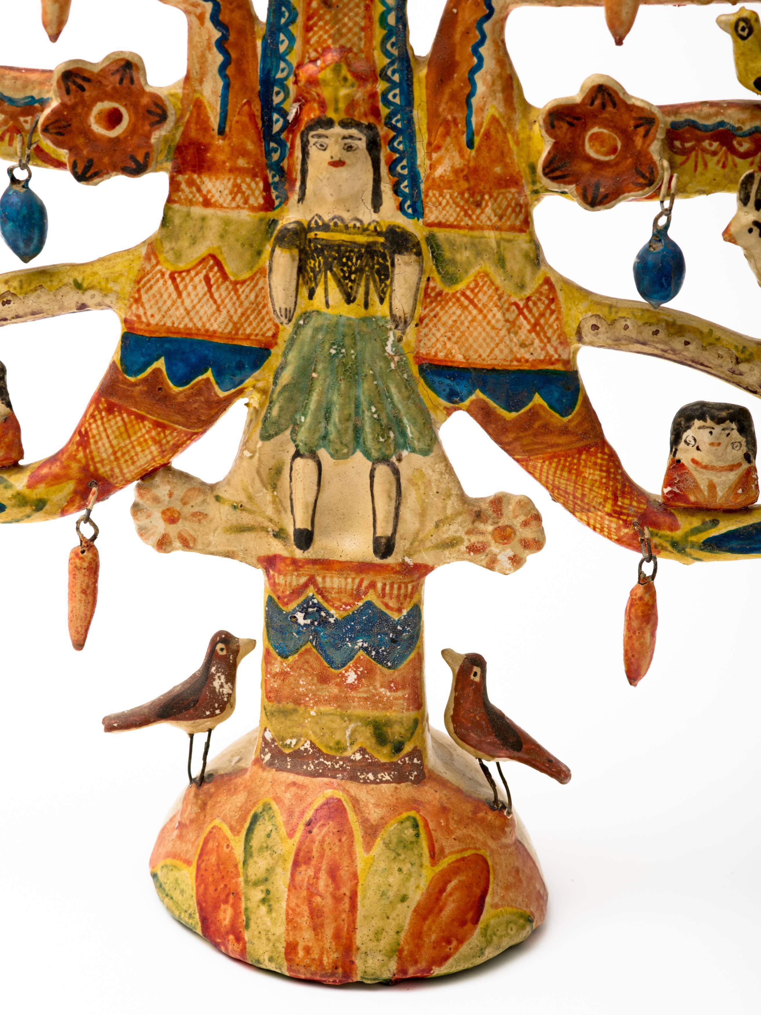 Large Aurelio Flores hand crafted pottery tree of life candelabra from Izucar de Matamoros, Mexico, circa 1950s. Flores began the tradition of crafting what are called arbol de la vida in his village, and is considered the master of the work. He