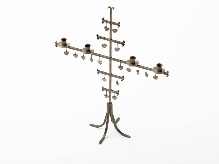 Midcentury Swedish hand-wrought steel candelabra with four candleholders.
18 cut steel hearts adorn frame. Signed with stamp, Made in Sweden.
   