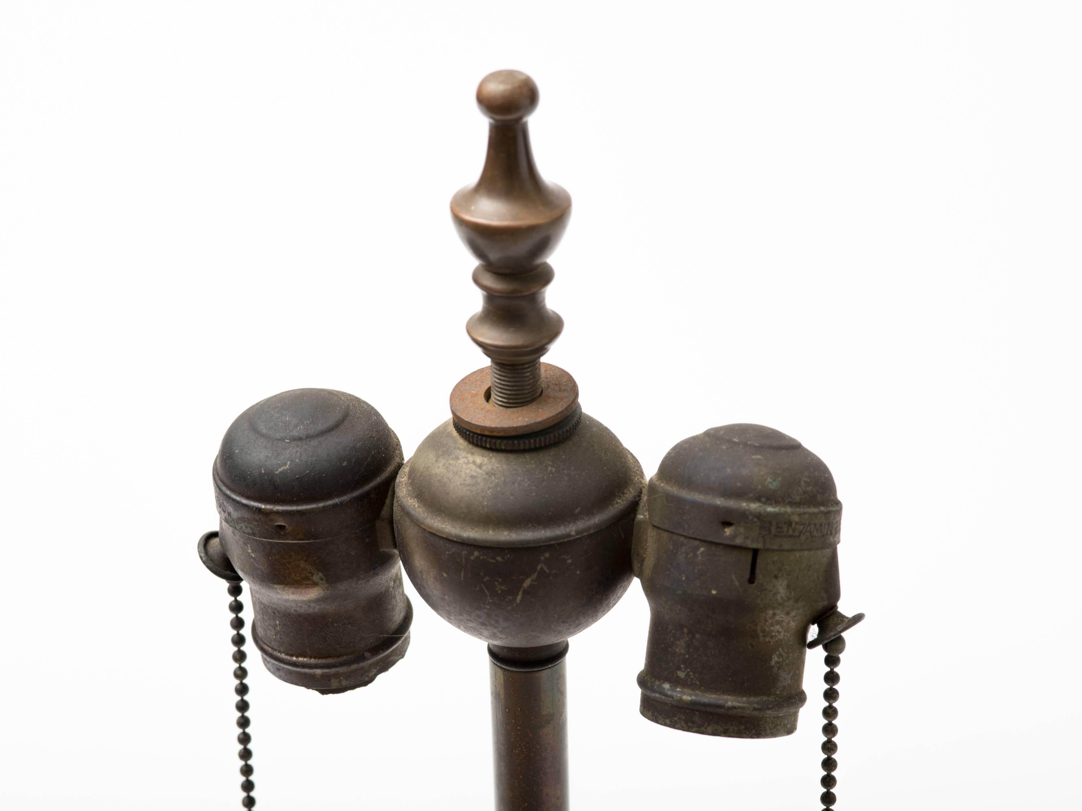 Machine Age patinated brass skyscraper lamp with circular stepped base and central brass stepped column, USA, circa 1930s.