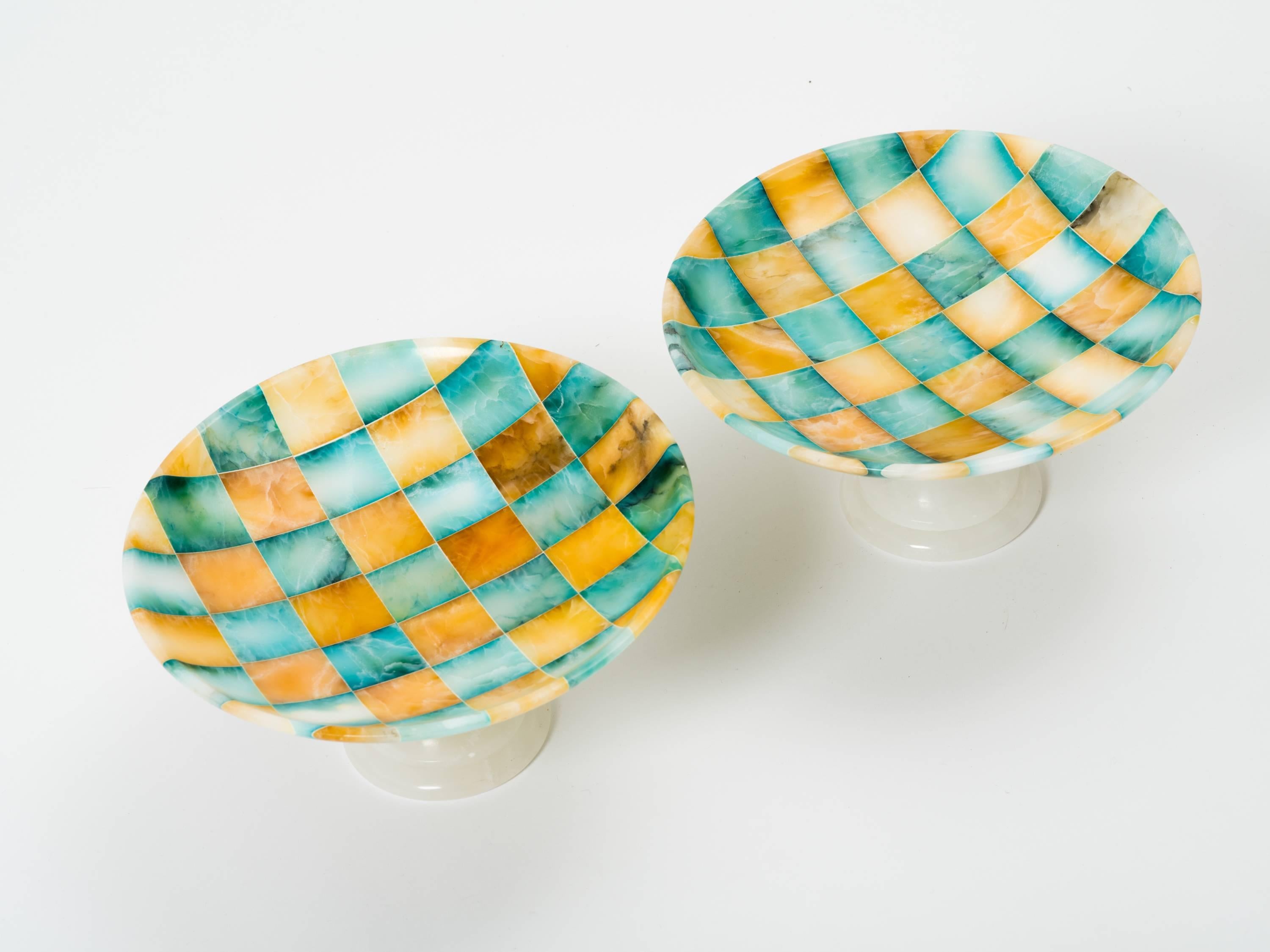 Pair of vintage unused handcrafted alabaster tazzas with checkerboard design bowl on white pedestals. Italy, 1960s.
