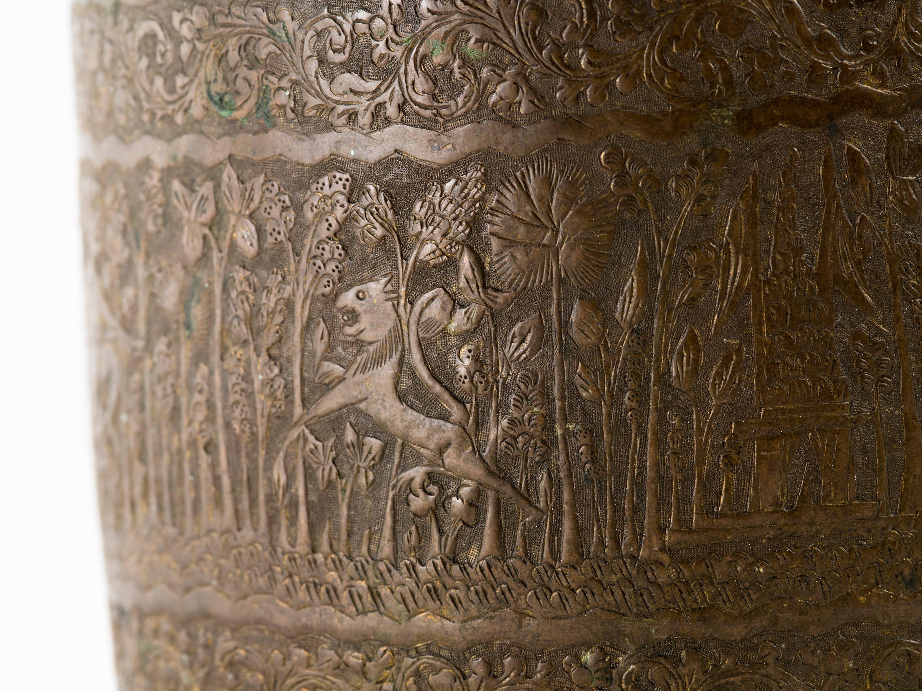Antique Indian engraved brass vessel jardinière. Engraving is finely detailed depicting a Maharaja on a hunt through the forest on outside of entire vessel.