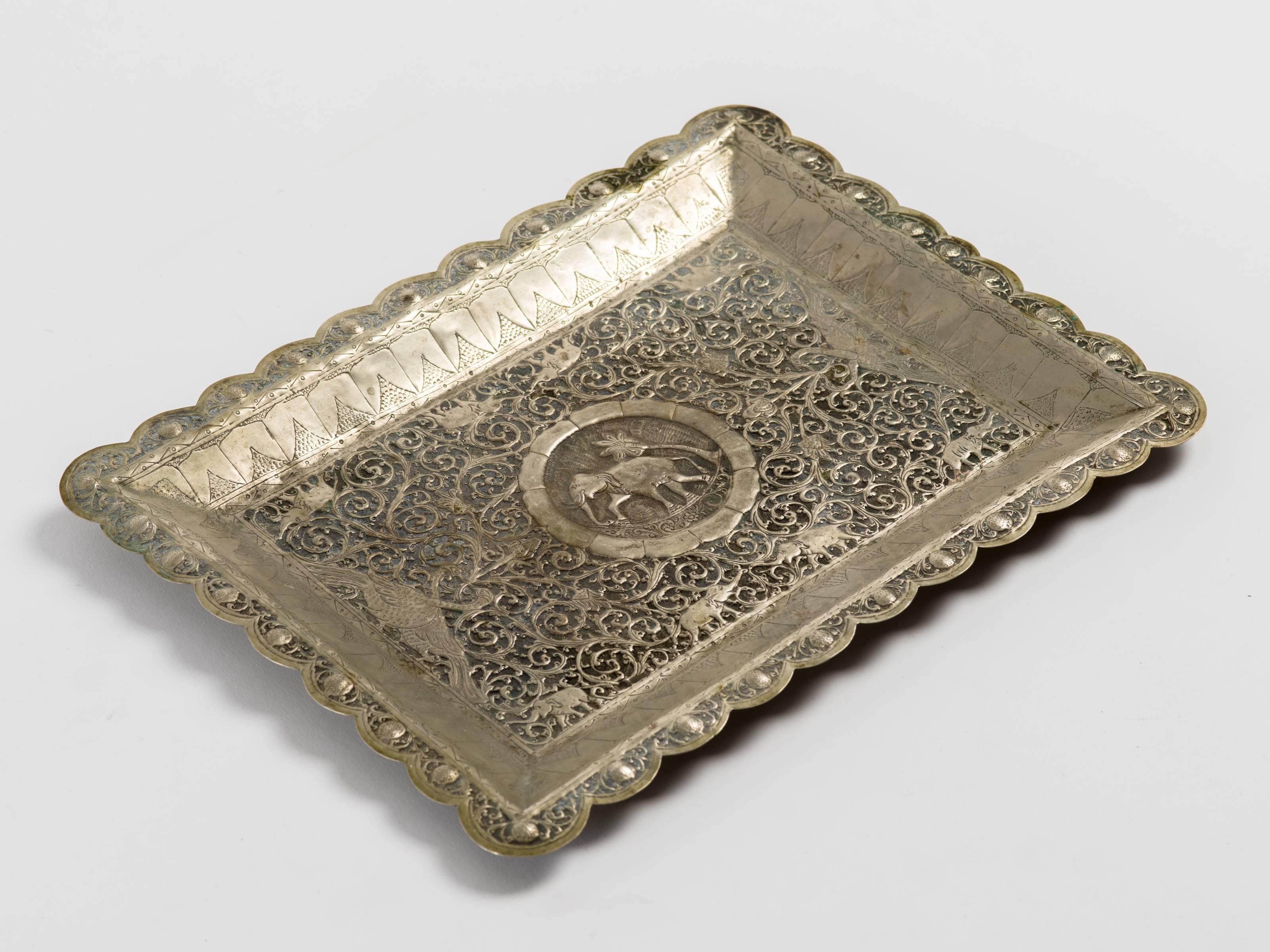 Antique Indian finely hand engraved and embossed tin serving tray with Mughal motifs.
