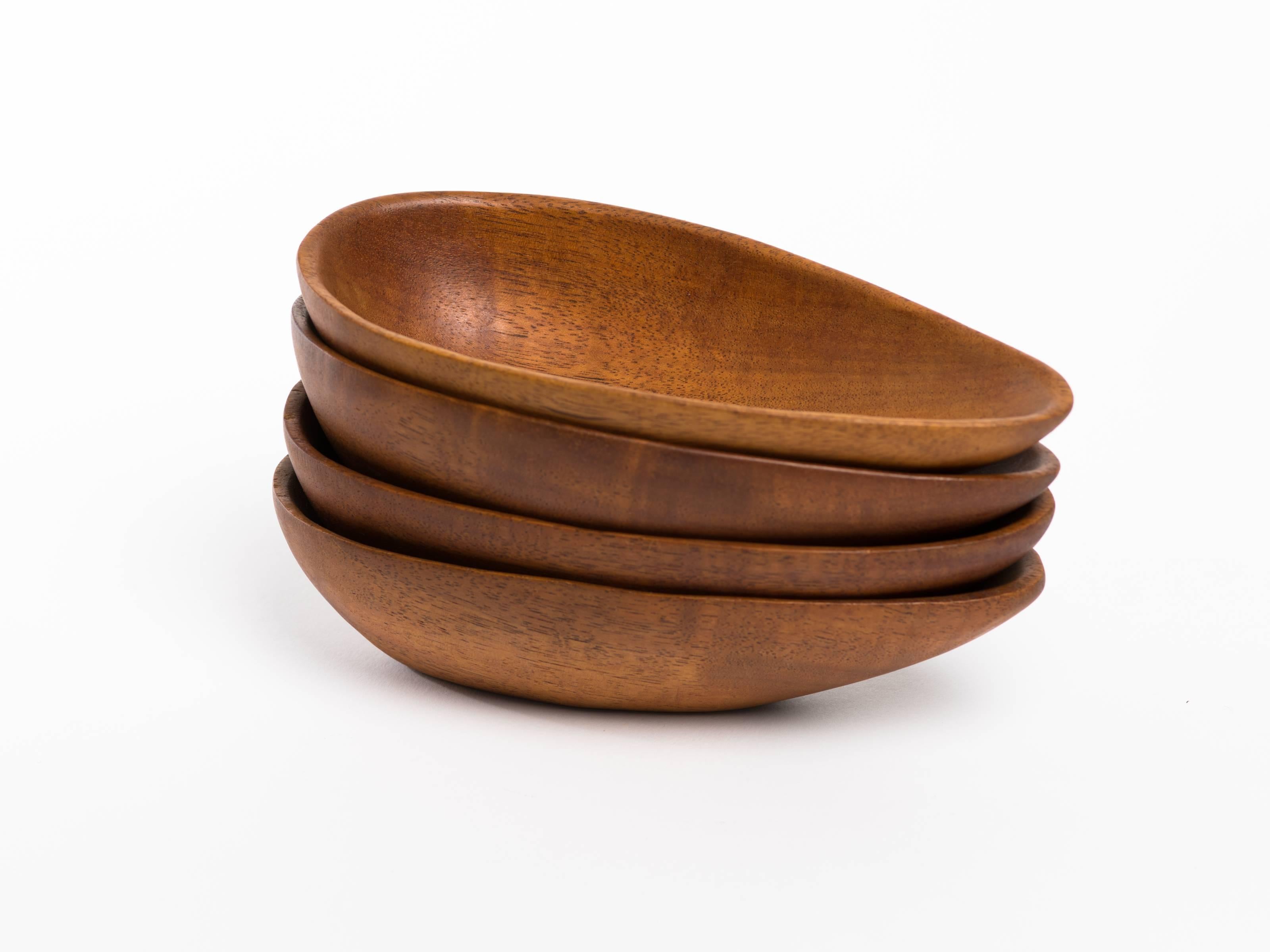 Set of four Danish teak nut / salad bowls in tear drop form. Attributed to designer Laur Jensen, Odense, Denmark.