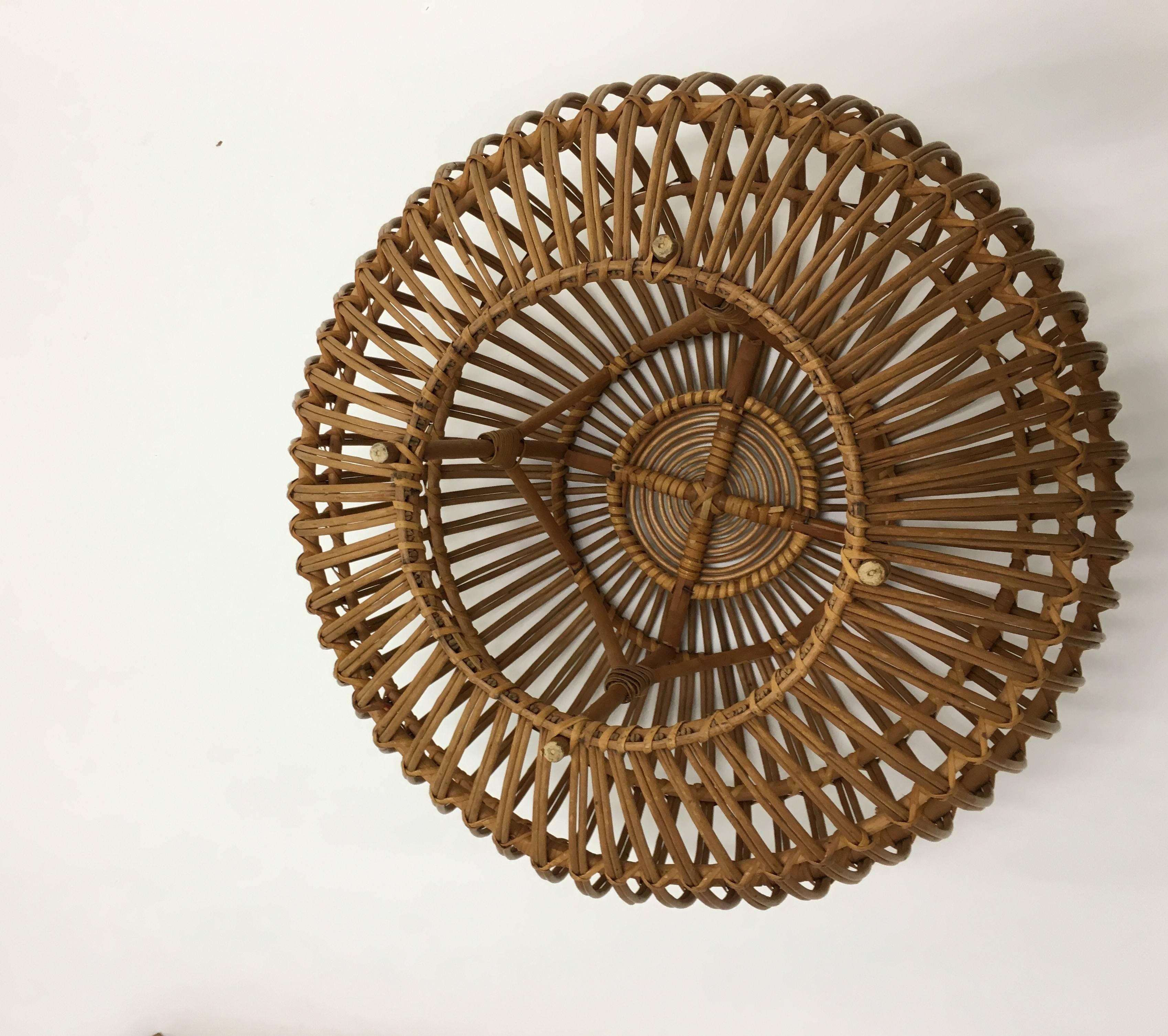 Useful round rattan ottoman attributed to Franco Albini and made in Italy. This example from the 1960s.
