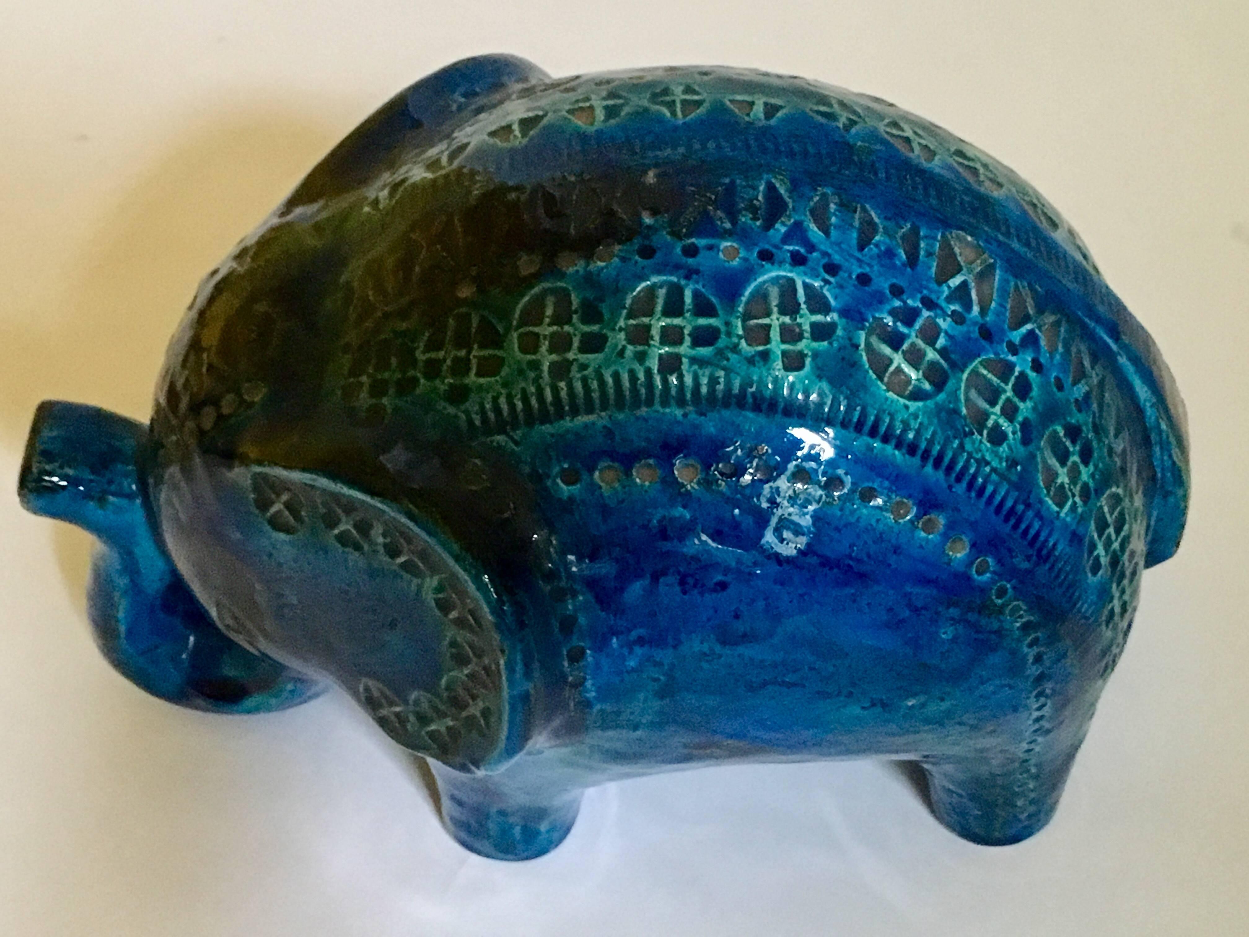Hand-carved pottery elephant designed by Aldo Londi. Rimini Blu (turquoise) high glaze with incised geometric ornament. Signed under heavy glaze.