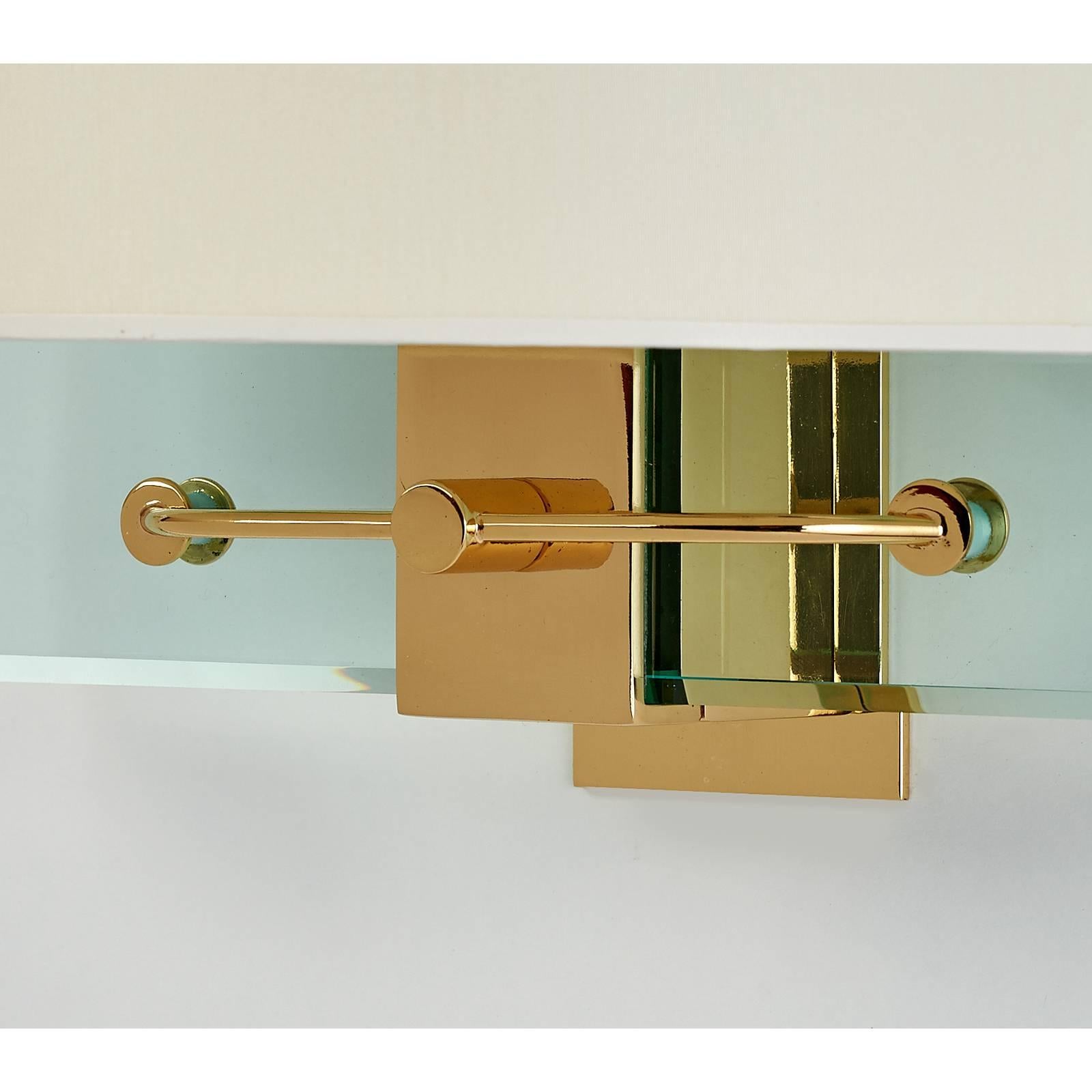 Nathalie Grenon for Fontana Arte.
A stunning pair of Fontana Arte glass and polished brass sconces, designed by Nathalie Grenon for Bulgari in 1990.
Sold and priced as a pair
Dimensions: 13.5 W x 15 H x 7 proj.
Rewired for use in the USA with four