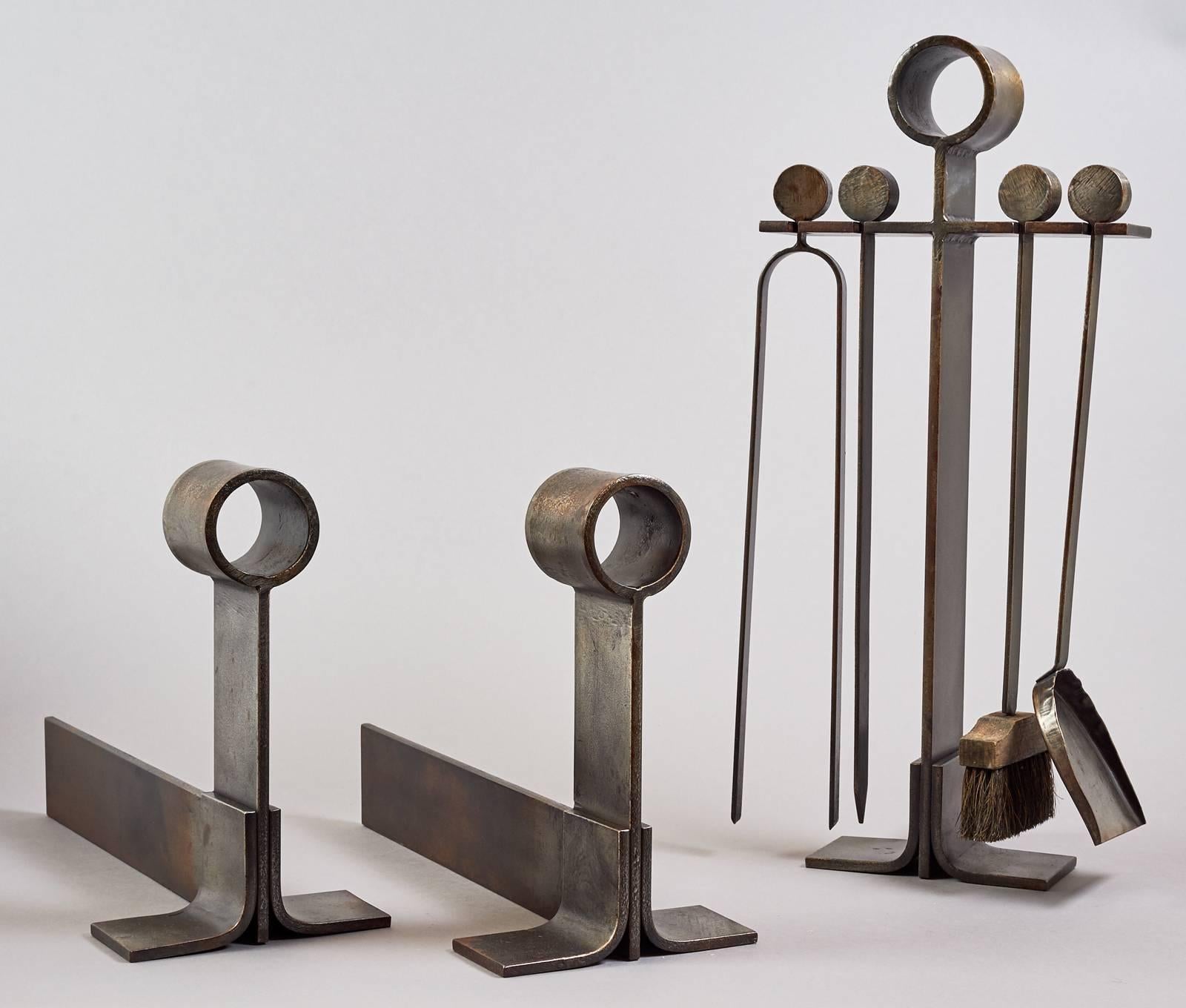 France, 1950s.

A complete set of modernist fire tools and andirons in beautifully worked massive wrought iron.

Andirons: 7 W x 18 D x 12 H.
Tools: 11 x 7 x 23 H.