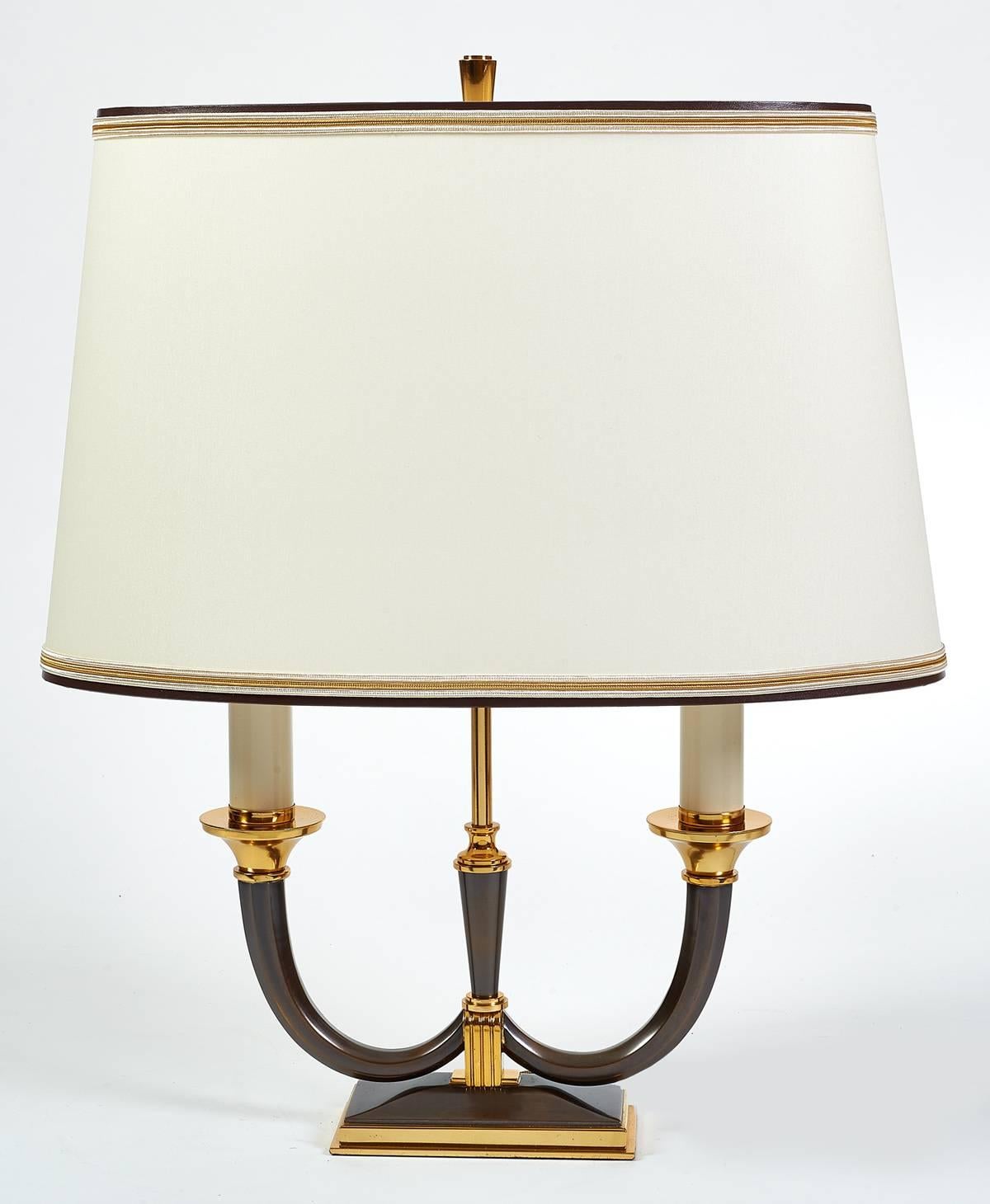 Genet Michon.
Pair of elegant oxidized and polished bronze table lamps with faceted arms and fluted mounts. France, 1950s.
Rewired for use in the USA.
Dimensions: 16 x 8 x 19 H.