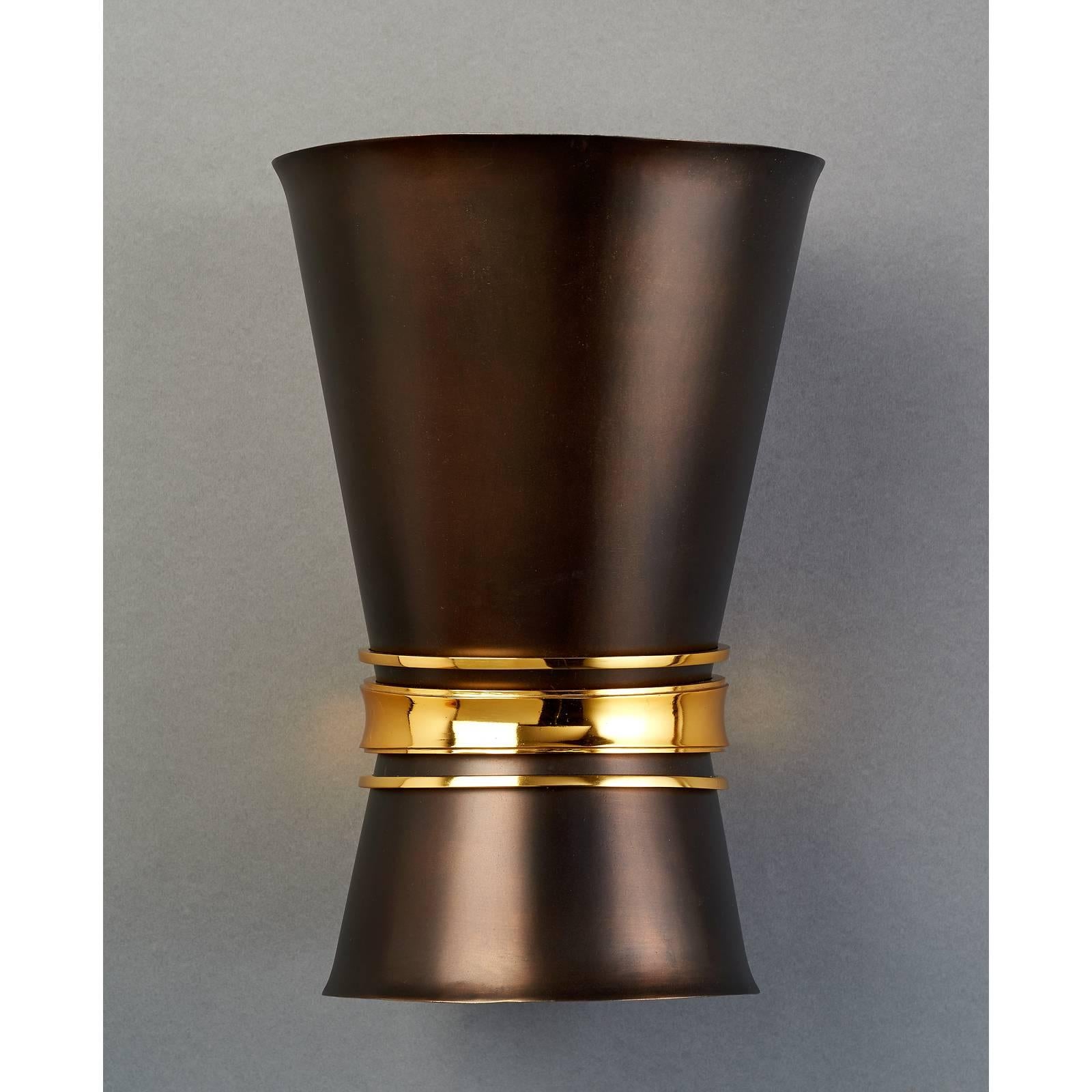 France, 1950s.
A stunning pair of sconces in oxidized metal with rich polished bronze mounts,
attributed to Maxime Old.
Rewired for use in the USA: Standard base downlight, halogen uplight.
Measures: 9 W x 13.5 H x 10 proj.