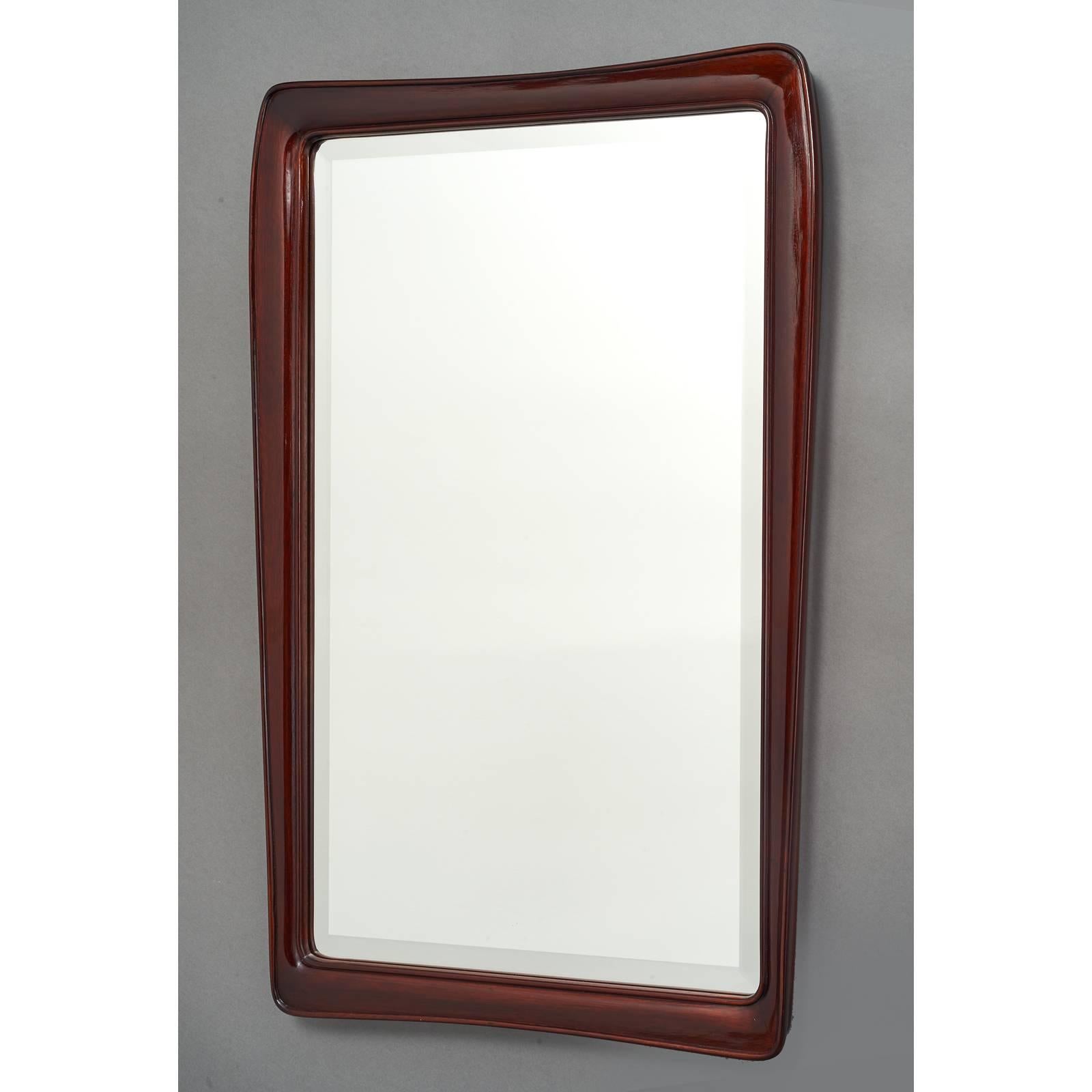 Italy, 1930s.
Handsome liberty style carved mirror in polished mahogany.
Beveled glass.
Measures: 38 x 24.5.