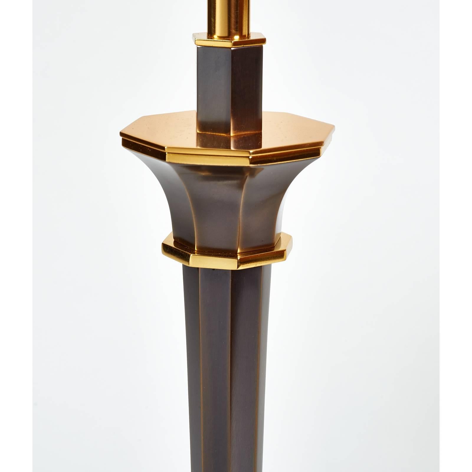 Genet Michon
Table lamp with tapered octagonal shaft
Oxidized and gilt bronze, France, 1950s
Rewired for use in the USA with two standard base bulbs
Dimensions: 17 Ø x 34 H.