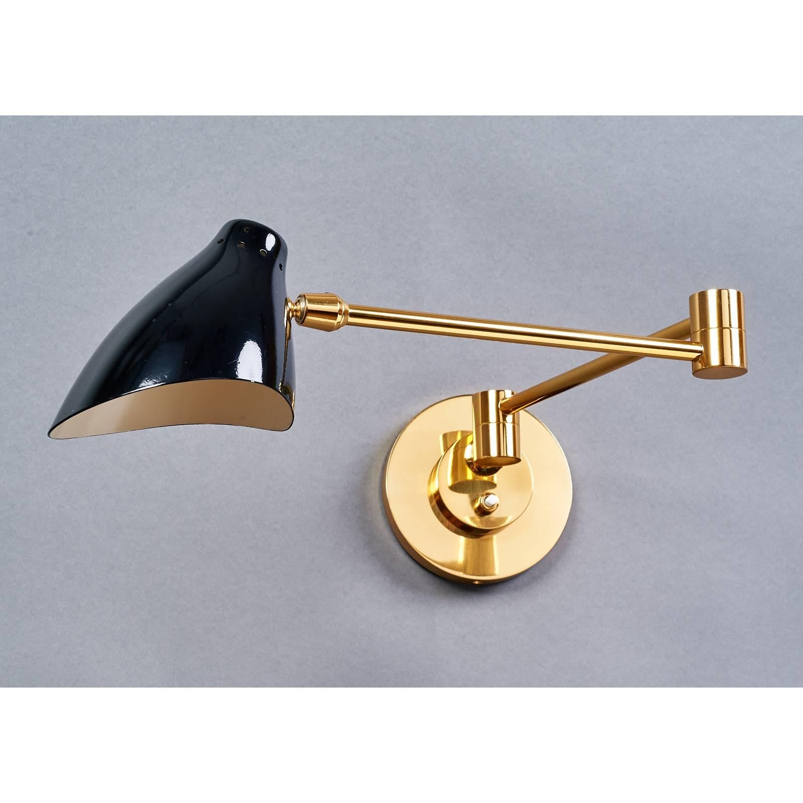 Italy, 1950s
A lovely and diminutive pair of polished brass swing arm sconces with
elegantly turned perforated elliptical shade in black enamel.
Arm: folded 14 (9 off center); extended 24;
Backplate: 4.5 Ø
Rewired for use in the USA.