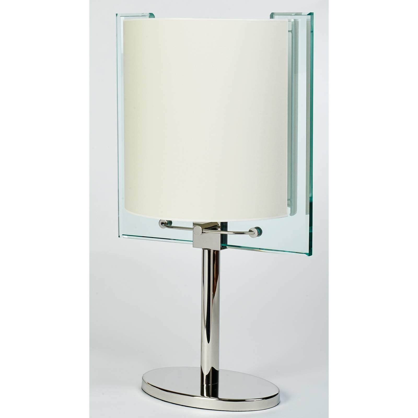 Nathalie Grenon for Fontana Arte
An important Fontana Arte table lamp, designed by Nathalie Grenon,
in glass and polished nickel. 
Italy, circa 1990
Dimensions: 24 H x 13.5 W x 10 D
Rewired for use in the USA with four candelabra base bulbs
 