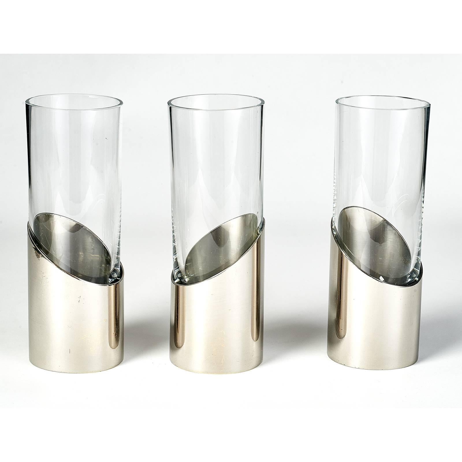 GABRIELLA CRESPI ( 1922-2017 )
Set of three modernist bud vases
Silvered brass and glass,
Signed on base . Italy, 1970s
Dimensions: 7 H x 2.5 Diameter
Priced and sold as a set. 

 