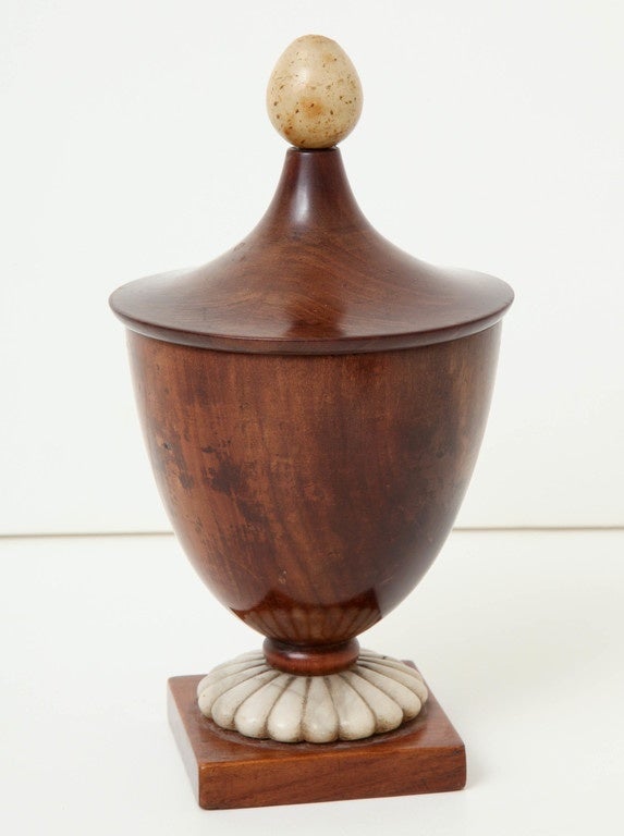 A fine early 19th century Continental neoclassic pearwood covered urn
with carved alabaster base collar and finial.