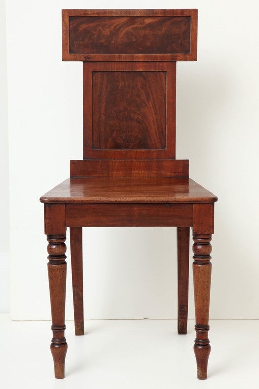 An English Regency mahogany hall chair, circa 1825