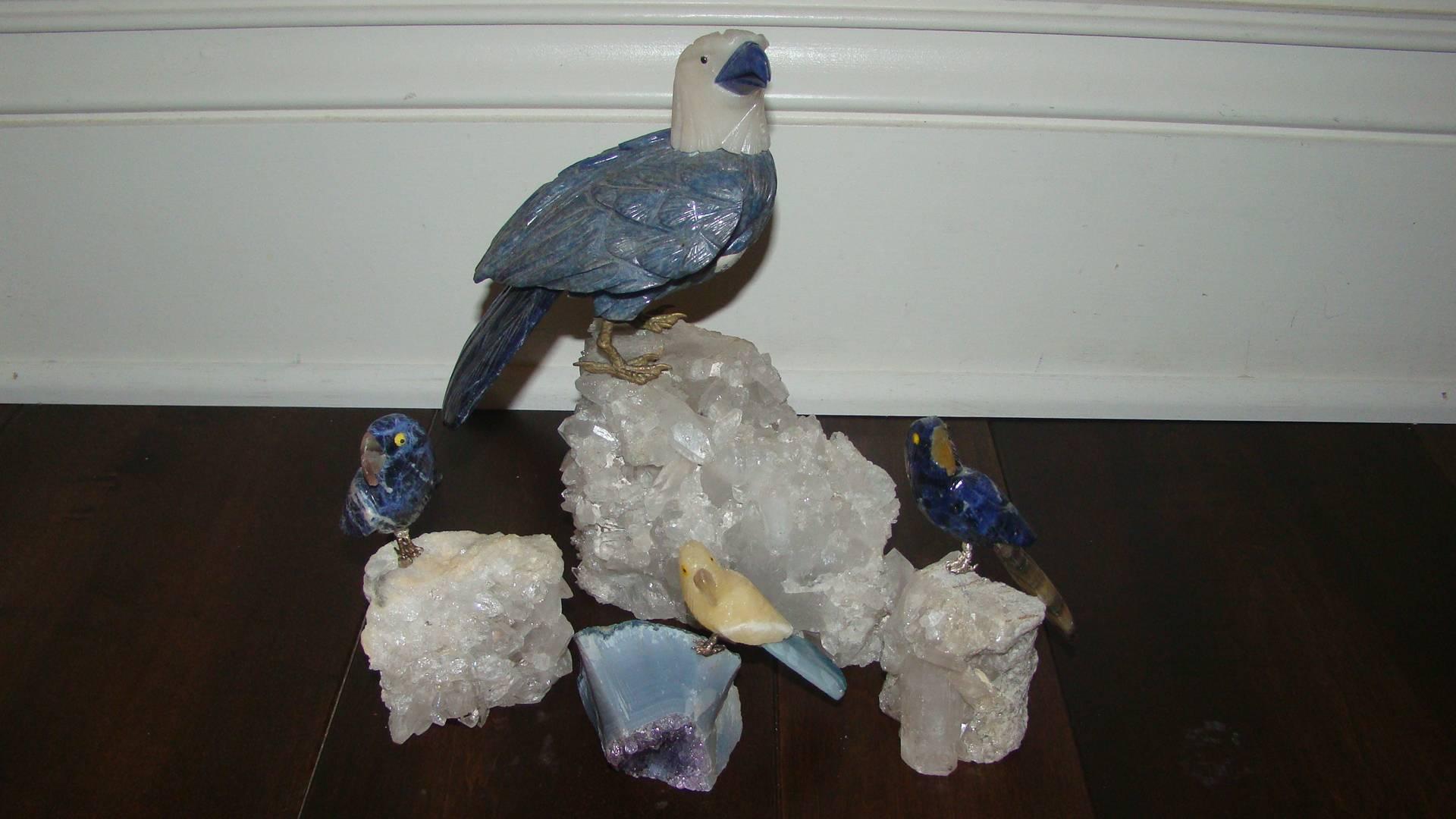 Great set of four quartz crystal and gemstone bird sculptures. Each are finely handcrafted of different gemstones with brass feet and quartz crystal bases. Very unique sculptures in person. Price is for the set of four.