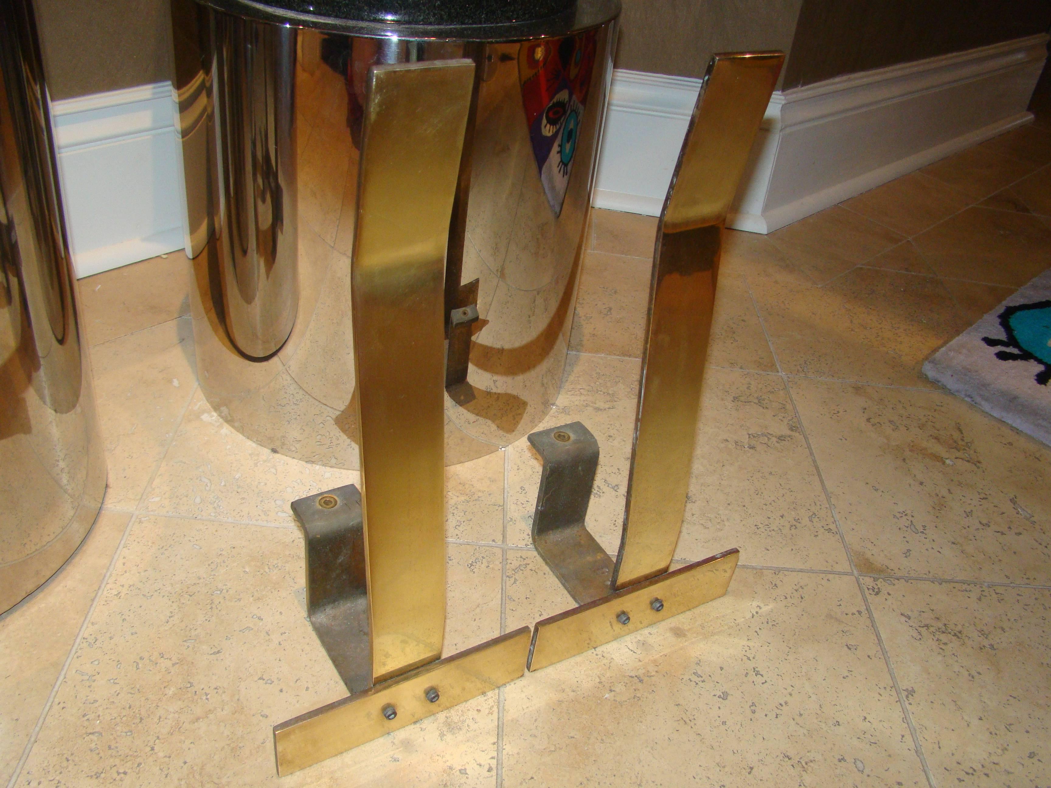 Pair of sculptural brass andirons by Danny Alessandro. This interesting pair are each comprised of solid brass with polished front and unique angular design.