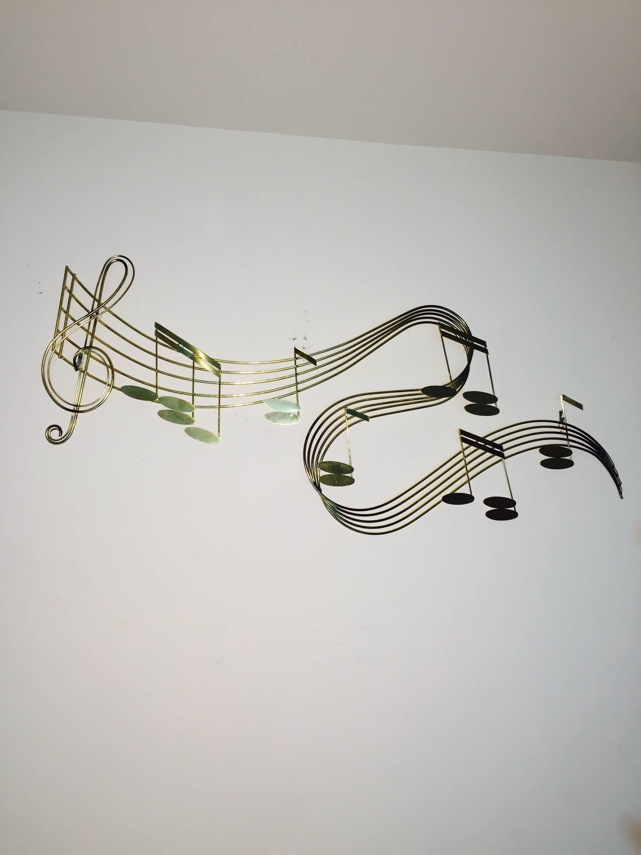 Beautiful 1970's Music Notes Wall Hanging Sculpture by Curtis Jere. This piece is comprised of thick welded brass in the abstract form of music notes. Perfect accent piece for your Home or Studio.  Signed C Jere 70. 